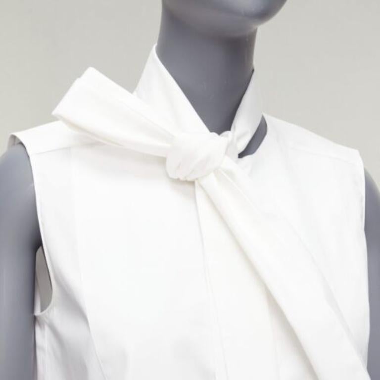 MONSE white cotton blend tie collar minimal classic tunic top US0 XS
Reference: AAWC/A00671
Brand: Monse
Material: Cotton, Blend
Color: White
Pattern: Solid
Closure: Button
Extra Details: Inverted pleat back. Tie neck detail.
Made in: