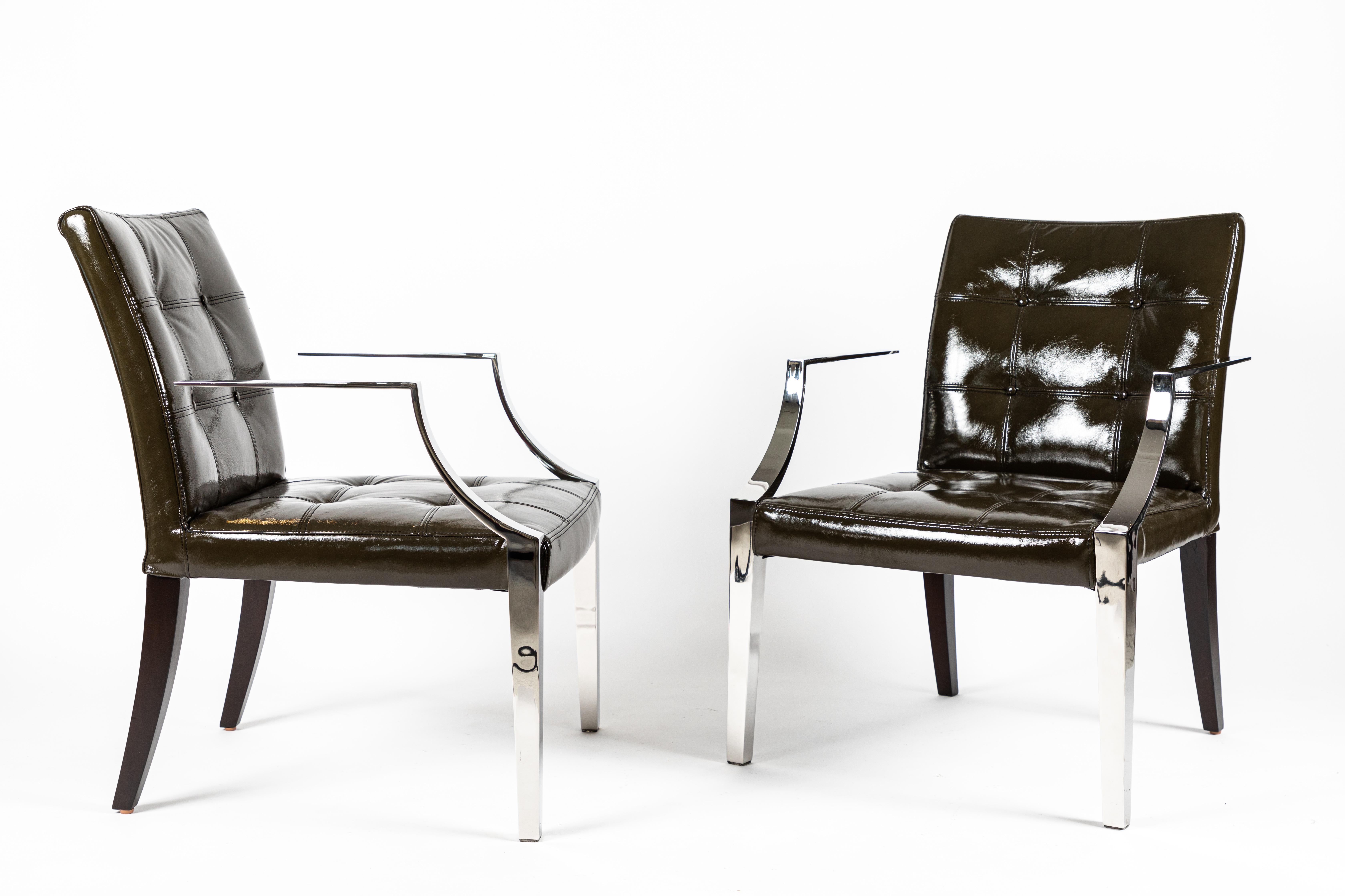 A chic pair of Monseigneur chairs by 20th century Master Philippe Starck. Acquired from the SLS Hotel in Beverly Hills after an extensive remodel. Newly upholstered in a dark olive green patent leather these chairs have also had the Stainless Steel