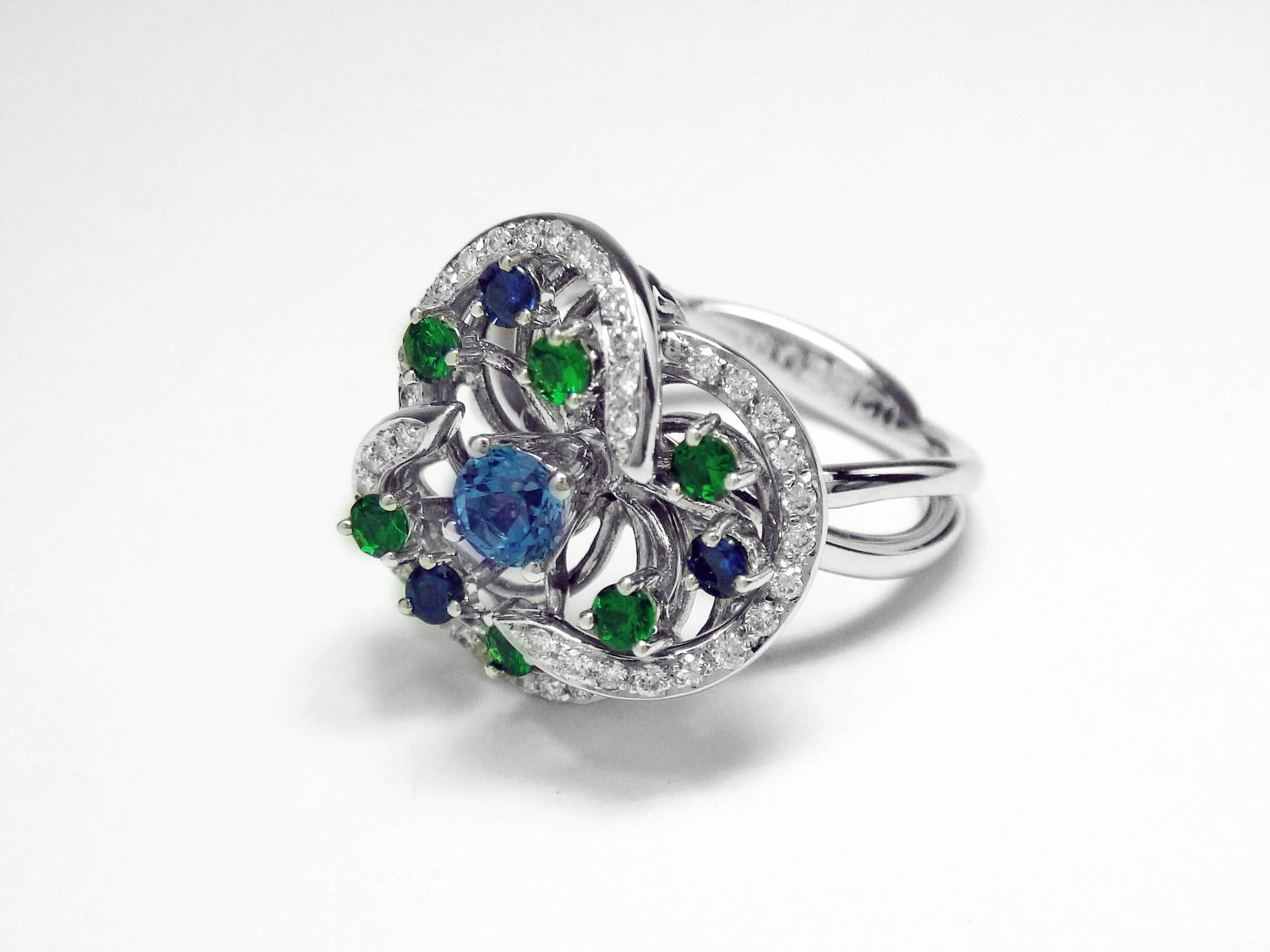 Contemporary Monseo Blue Topaz, Tsavorites, Sapphires and Diamond Floral White Gold Ring For Sale