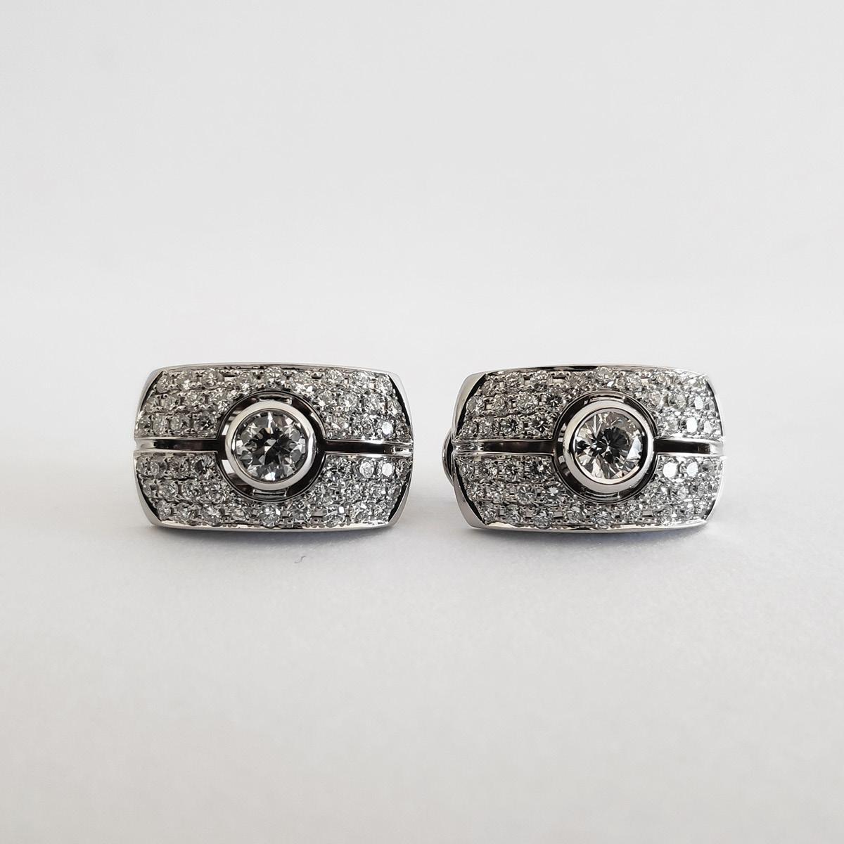 These omega clip earrings exhibit 1.75 carats total weight of dazzling pave setting diamonds and two brilliant cut diamonds, all mounted on 19.2K white gold. 

This piece are part of Monseo 'Eternal Collection' which is a collection that privileges