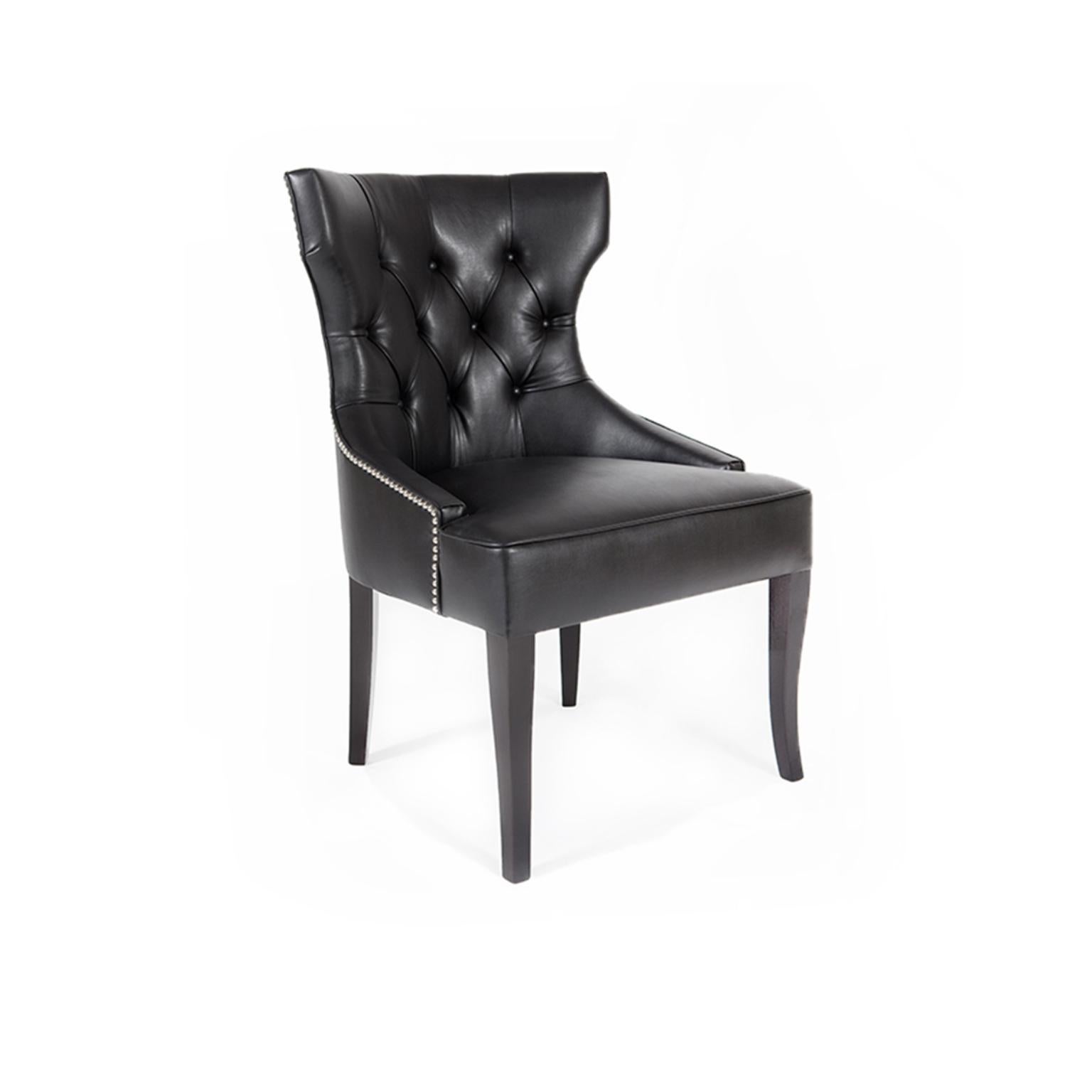 Monsieur T Chair by Munna
Dimensions: D 64 x W 64 x H 89 cm. SH: 45 cm.
Materials: Wood, foam, and leather.
Finish: Leather, ref. Black, L06 upholstery, black gloss lacquer legs, and plated nickel upholstery nails.

Available in all Munna fabrics