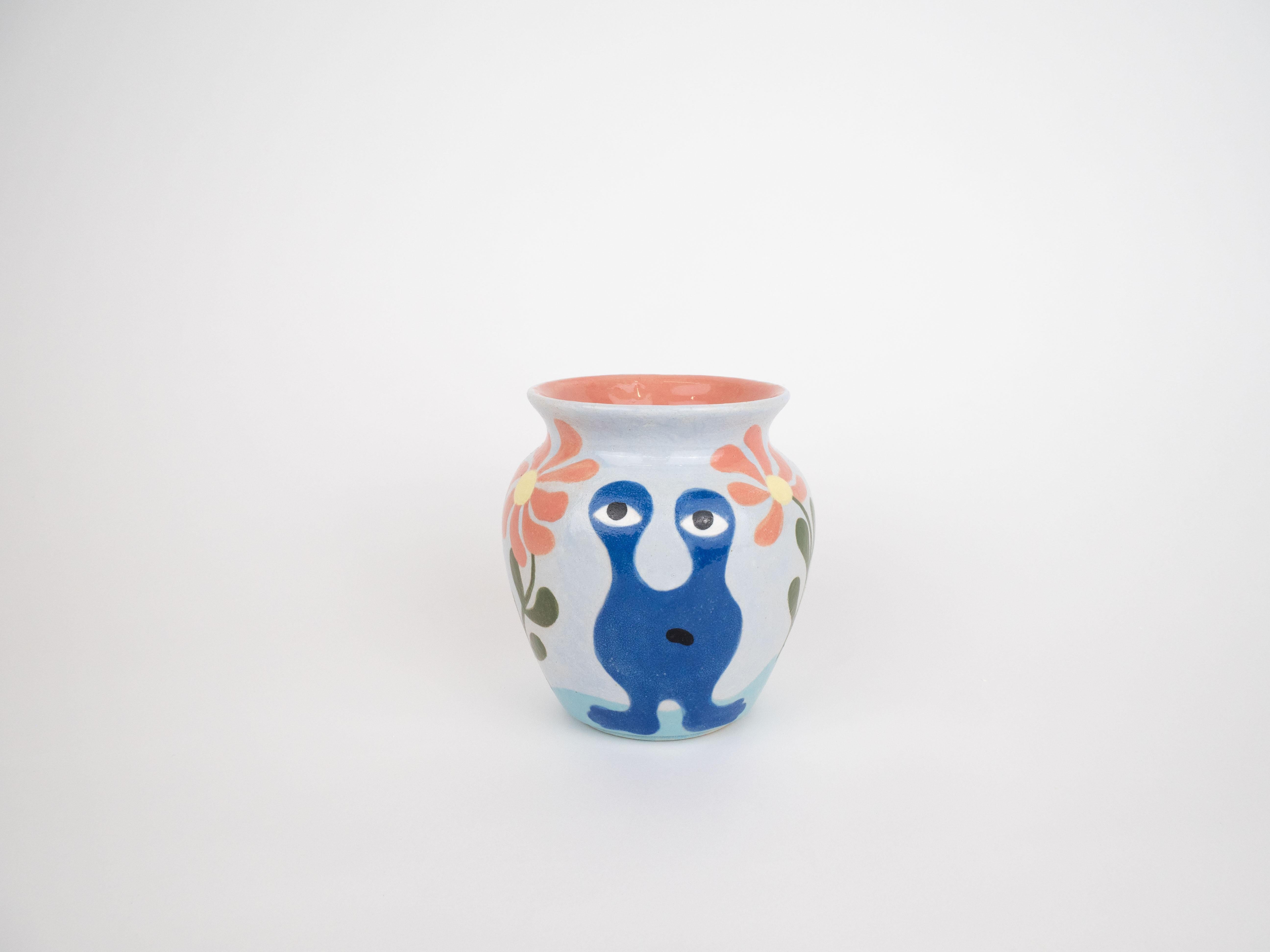 This hand-painted ceramic vase features illustrations of our classic monsters. The vase is finished with a glossy glaze perfect for hand-picked flowers from the garden.

Dimensions: H12.5 x D11 cm
Weight: 495 g 

Care Instructions: Hand wash 
