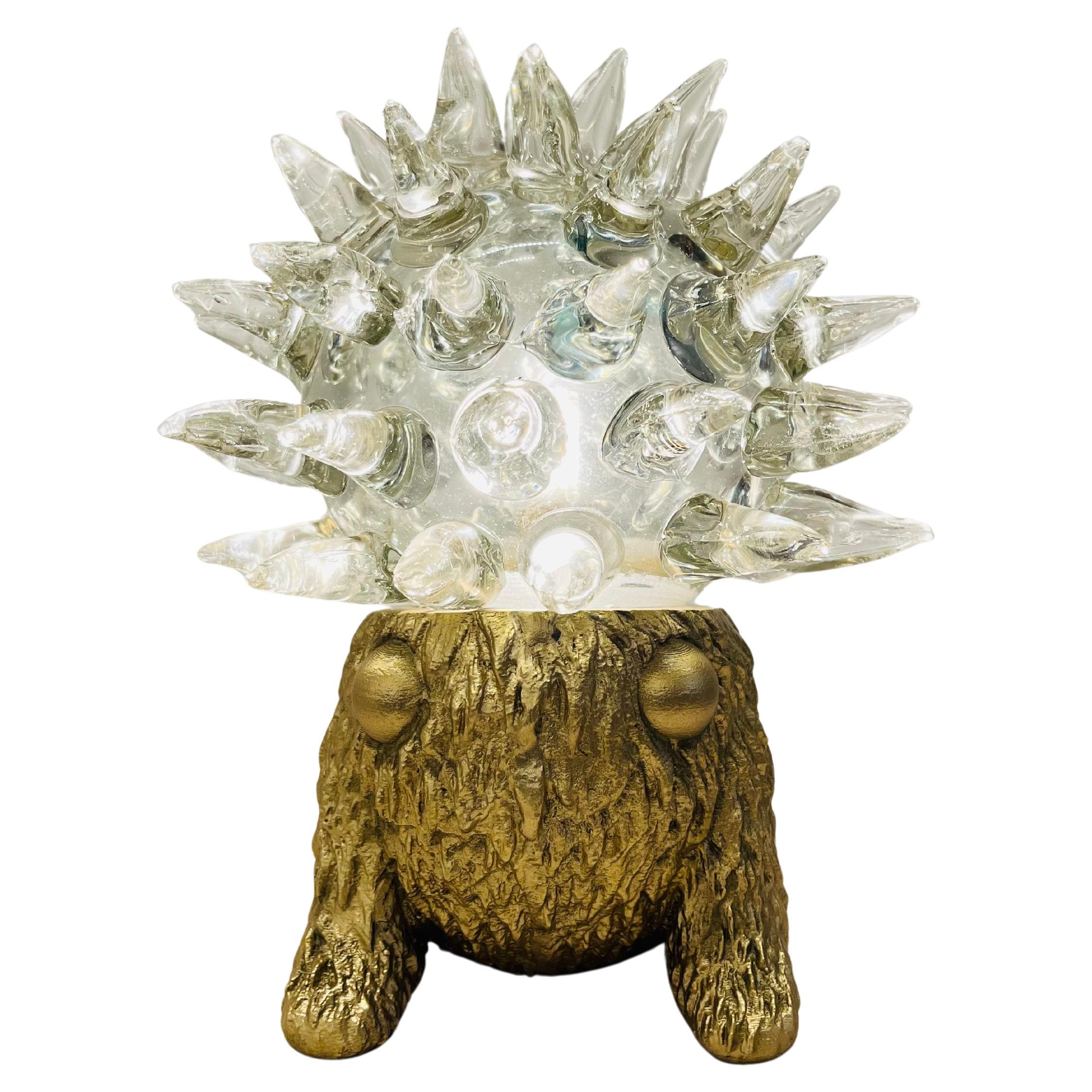 Monster Collectible : Monster Gattooffer

Unleash the extraordinary with the Monster Gattooffer Lamp-- a fearless fusion of art and light. Its bold, spiked silhouette defies tradition, making a statement that transcends function. More than just a