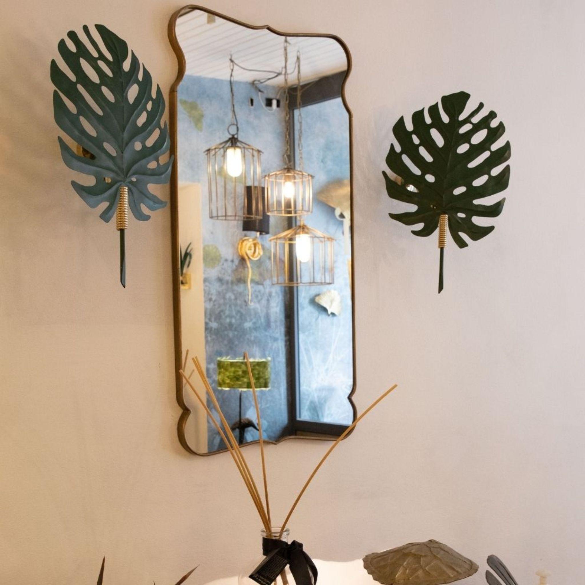 Transform your space with the enchanting Hortus Monstera Leaf Wall Light. Crafted from iron, this exquisite wall light features intricate laser-cut details and meticulous manual decorations, showcasing the beauty of the monstera leaf. With its