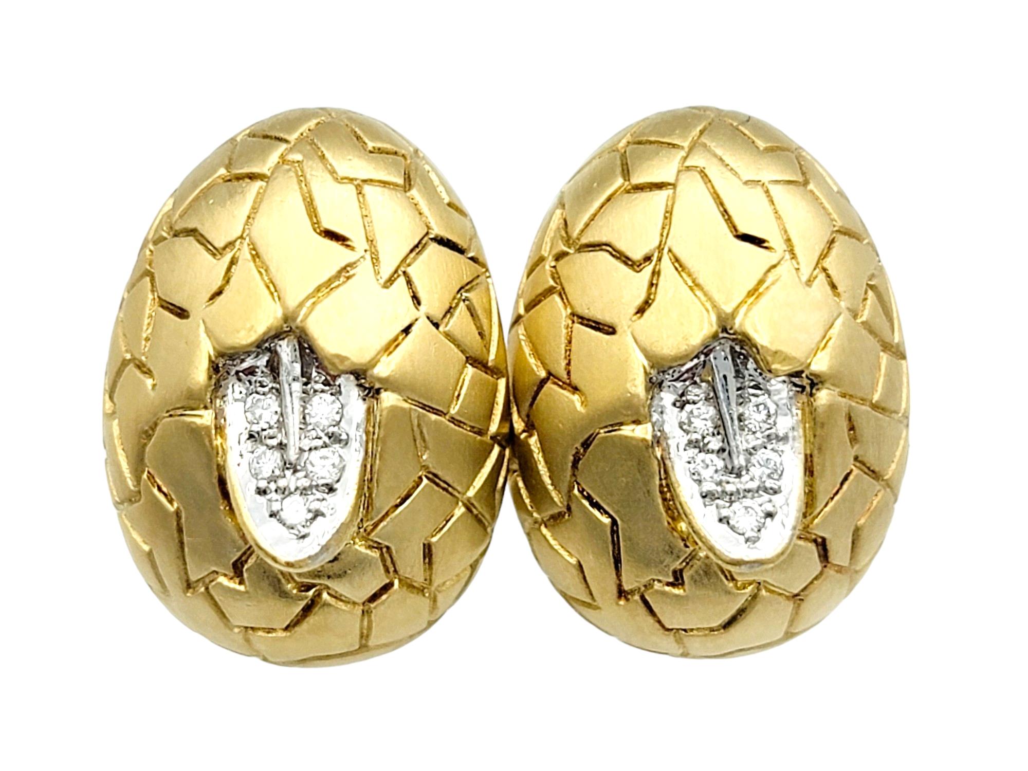 This stunning pair of Mont Blanc earrings, masterfully crafted in 18 karat yellow gold, are a work of art. These elegant earrings feature a distinctive crackled design in a brushed finish, adding a unique and artistic touch to their oval shape.

At