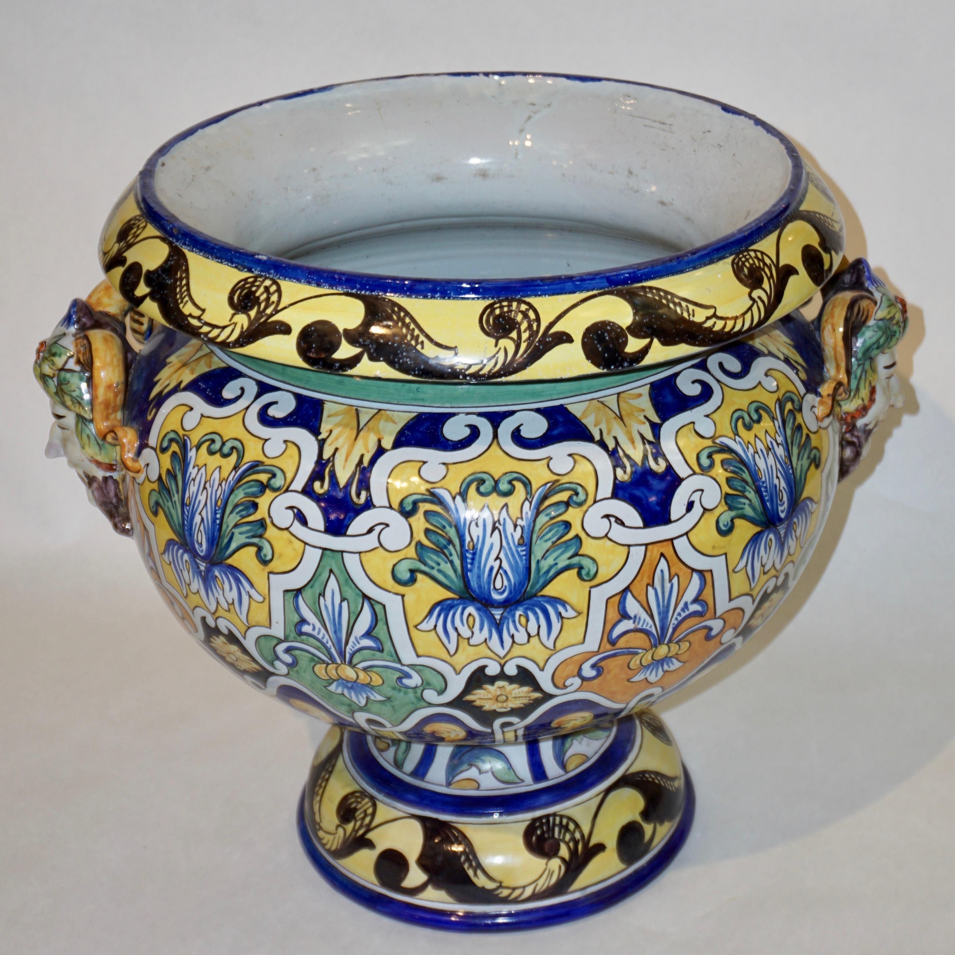 Circa 1875-1889, large two-part French Provincial faience jardinière / planter, entirely hand painted, with its matching rimmed stand that can also be used as a jardin d'hiver stool, with the signature of Antoine Montagnon (1838-1899), owner of the