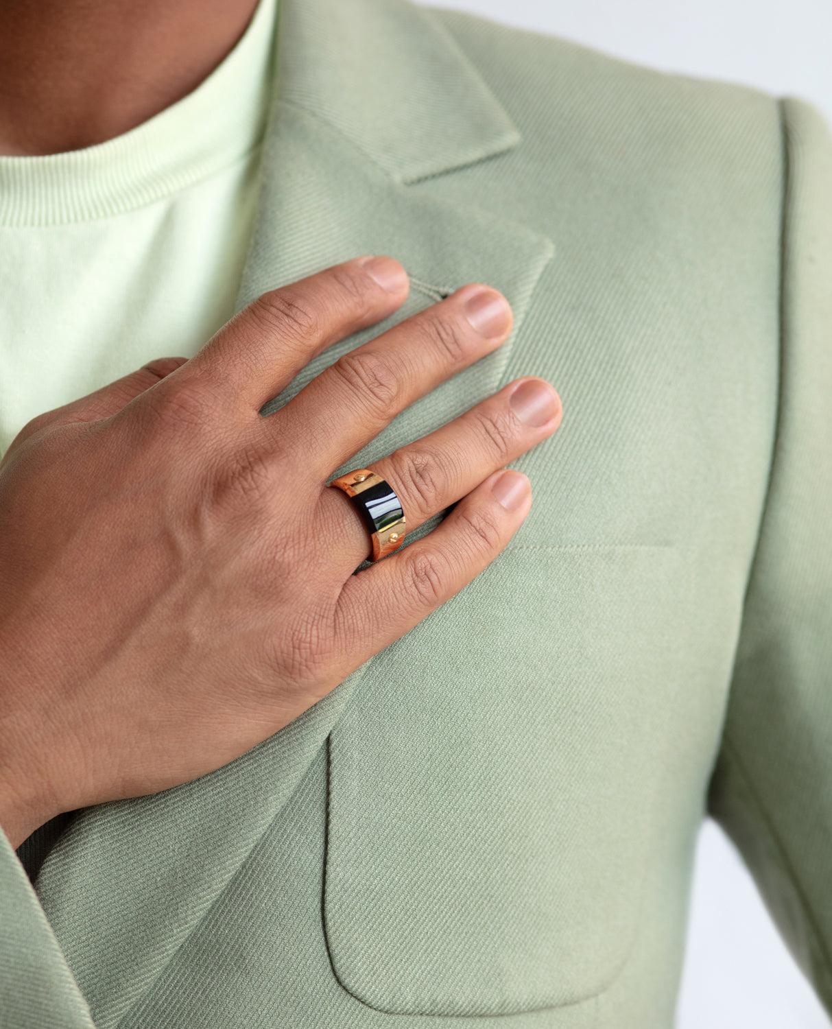 The MONTANA gold signet ring was designed with stunning classic solid gold. It includes a black onyx stone as its bold centerpiece aligned smoothly inside the ring. With signature Rockford screws, creating the combination of luxury and style in the