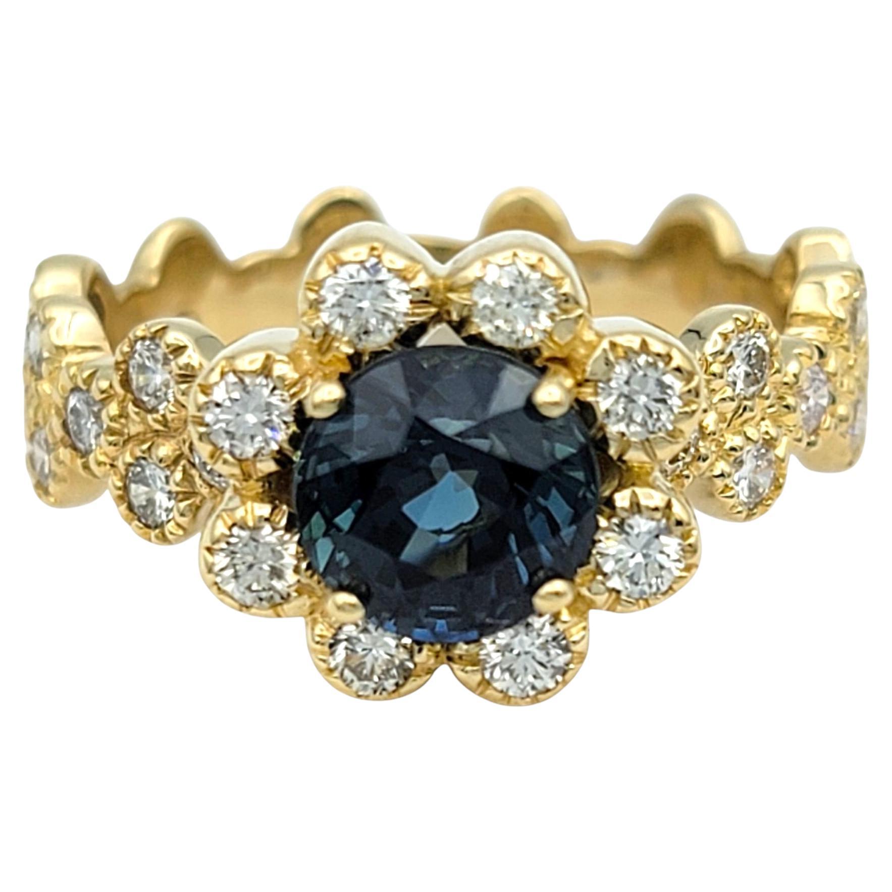 Montana Blue Sapphire and Diamond Halo Flower Motif Ring in 14 Karat Yellow Gold