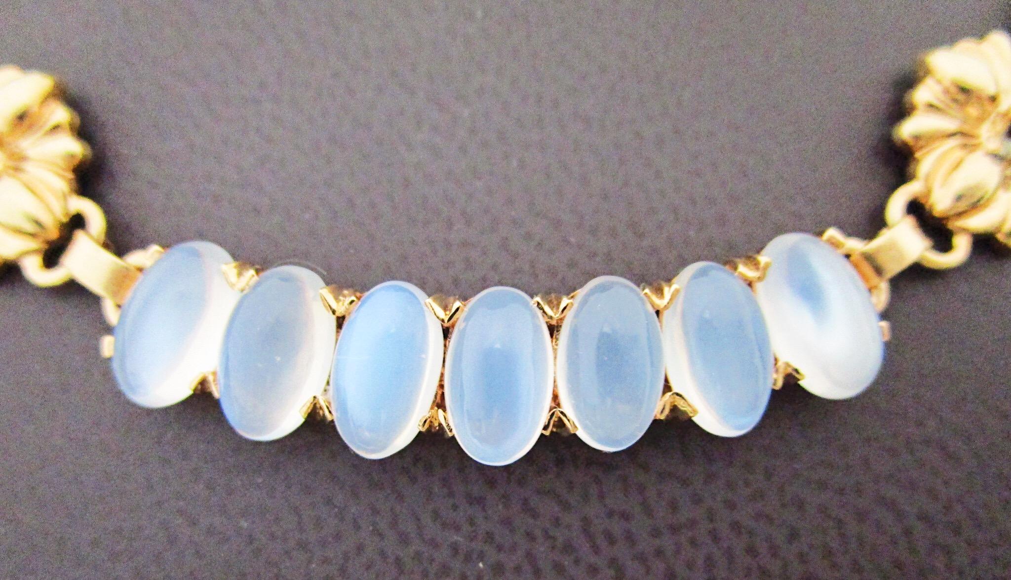 This necklace is delicate and dignified. The two Montana sapphires anchor a strand of glowing Moonstones all set in 14K yellow gold. Add a touch of classy-chicness to any ensemble.   Don't let this beauty pass you by.

St. John and Myers Jewelry is