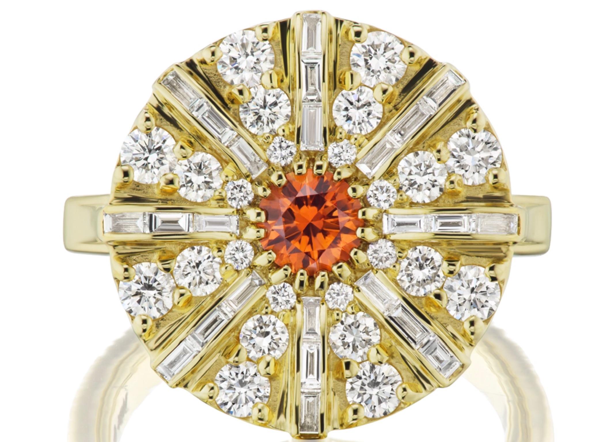 Fancy .49 carat Tangerine Sapphire in a beautiful pinky orange shade. Montana mined sapphires are known for the clarity and vivid colors, especially in the fancy color variety (lavender, orange, green, pink). This is no exception. It is mounted in