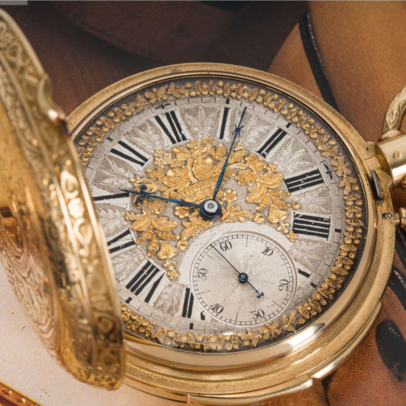 Montandon Freres. A Heavy 18ct Gold Highly Engraved Keyless Lever Minute Repeater Full Hunter Pocket Watch C1880.

Dial: The superb dial made of silver and gold decorated with a gold garland of flowers and gold flowers around the edge of the dial