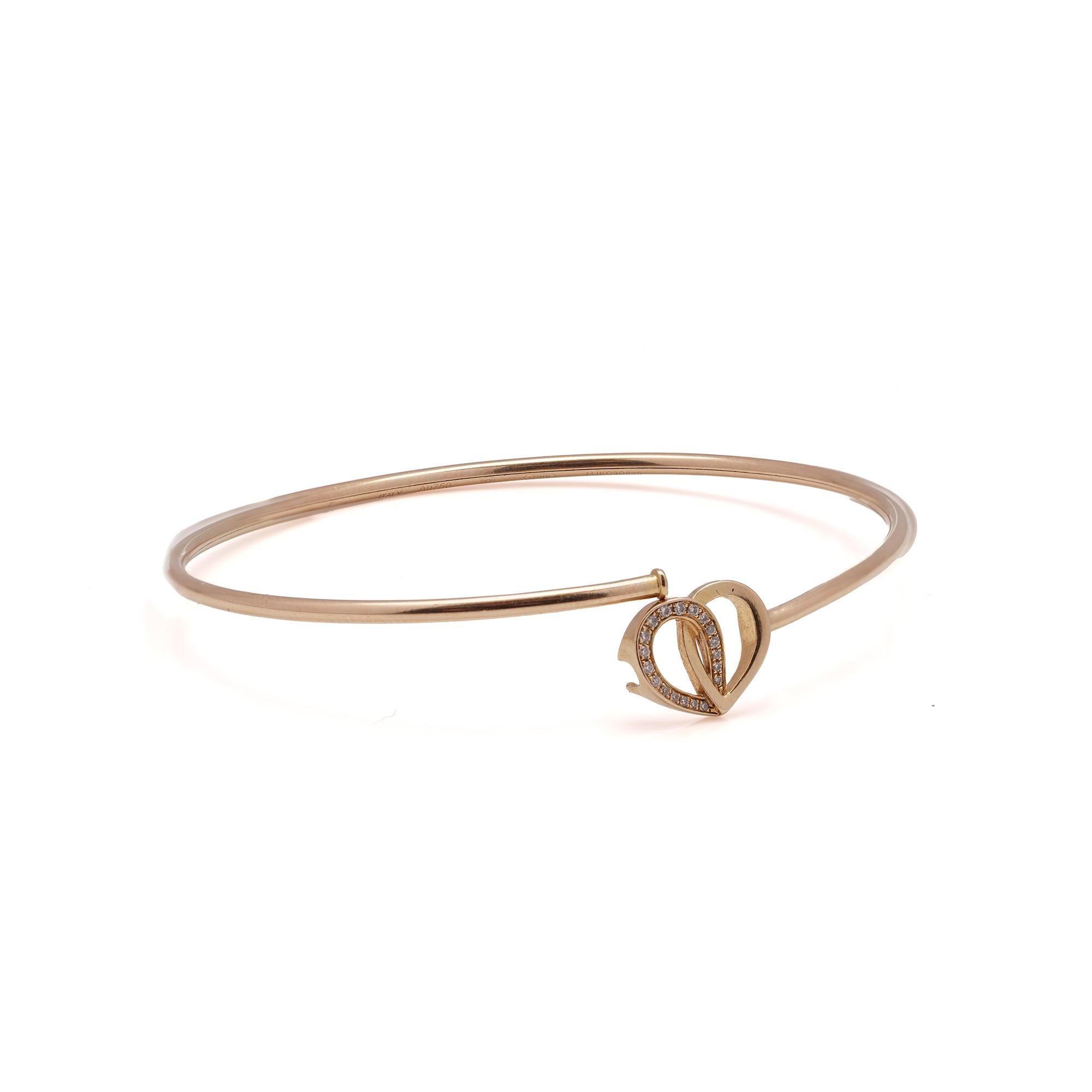 Montblanc 18kt pink gold Valentine's day collection heart-shaped bangle with diamonds. 
Made in Italy, After 2000.
The rose petals are intertwined to form a heart shape. 
Fully Hallmarked with serial number, 750 mark, Italian assay marks.
