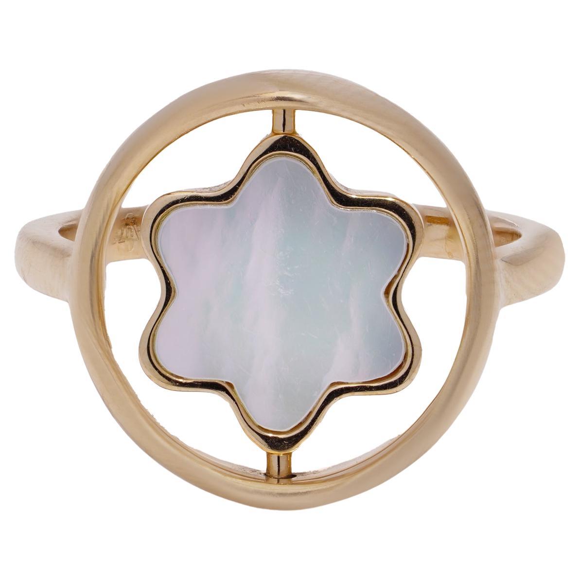 Montblanc 18kt pink gold ring with rotating mother-of-pearl star emblem.