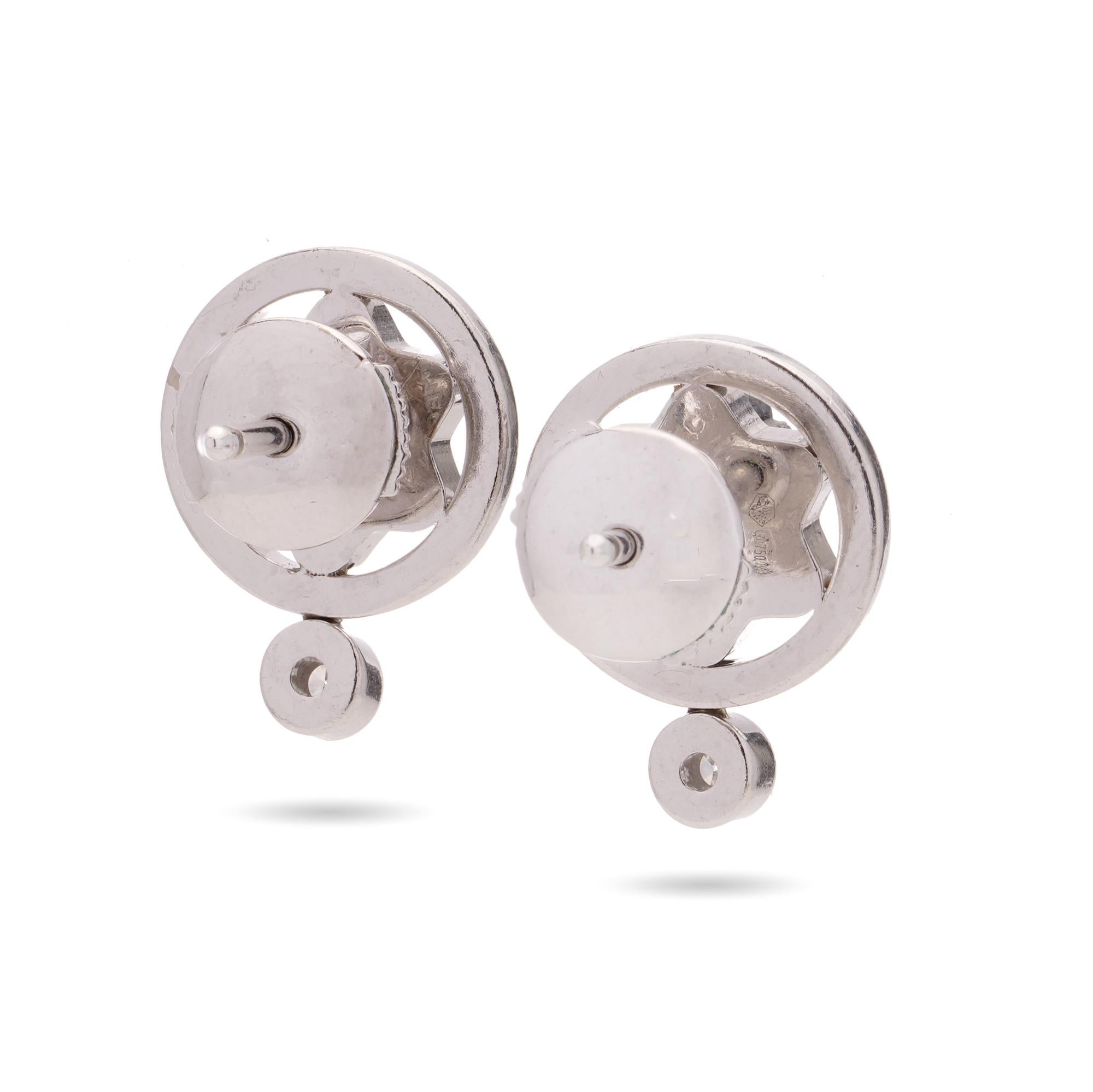 Montblanc 18kt white gold pair of Star emblem studs with diamond accent. 
Made in Italy, After 2000.
Fully Hallmarked. 

Dimensions:
Length x width: 1.4 x 1.2 cm 
Weight: 7.00 grams

Diamonds -
Cut: Round brilliant 
Quantity: 2
Total carat weight: