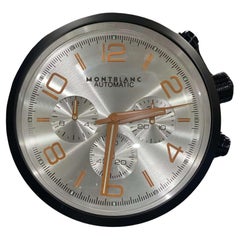 Horloge murale Montblanc de luxe à cadran argenté et orange