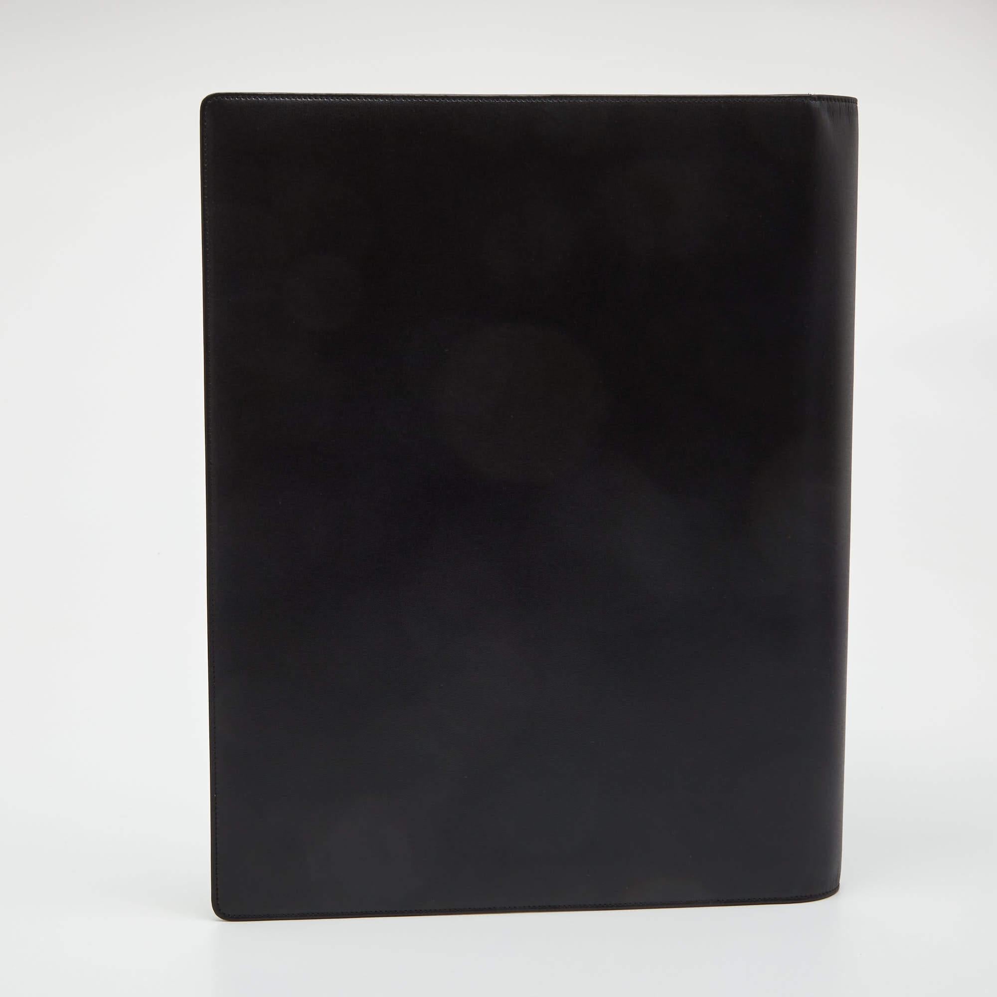 This practical and opulent conference folder will uphold all your professional details efficiently. Crafted from black leather, it features papers inside and the signature Montblanc star on the front.

Includes: Original Dustbag, Original Box, Paper