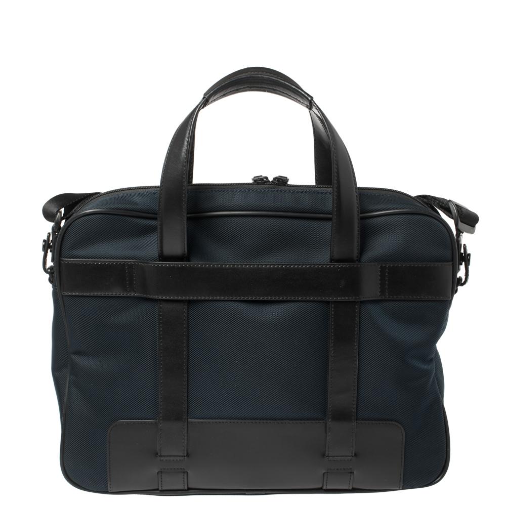 Hold your important essentials in this durable case by Montblanc. Crafted from fine leather & leather, the bag brings top handles, zip-enclosed nylon compartments, and the Montblanc logo and black-tone at the front. The Nightflight Document case