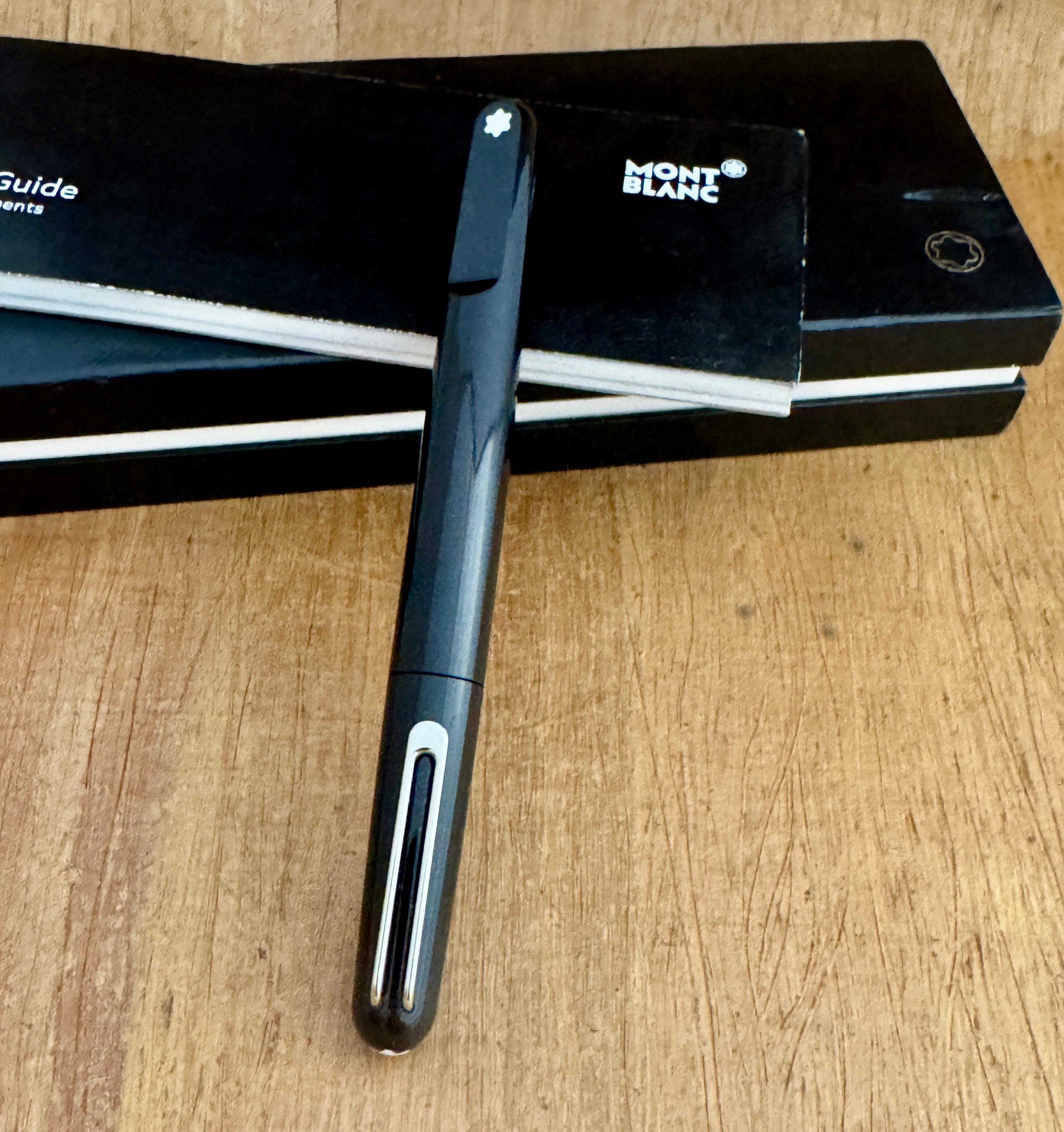  Montblanc Marc Newson Rollerball magnetic Pen Boxed , Loaded With Montblanc Black Cartridge .

Details:

Condition : In Excellent Condition With Light Wear And marks Comes in Original Box and instructions .Please Check the pics

Material : Resin &