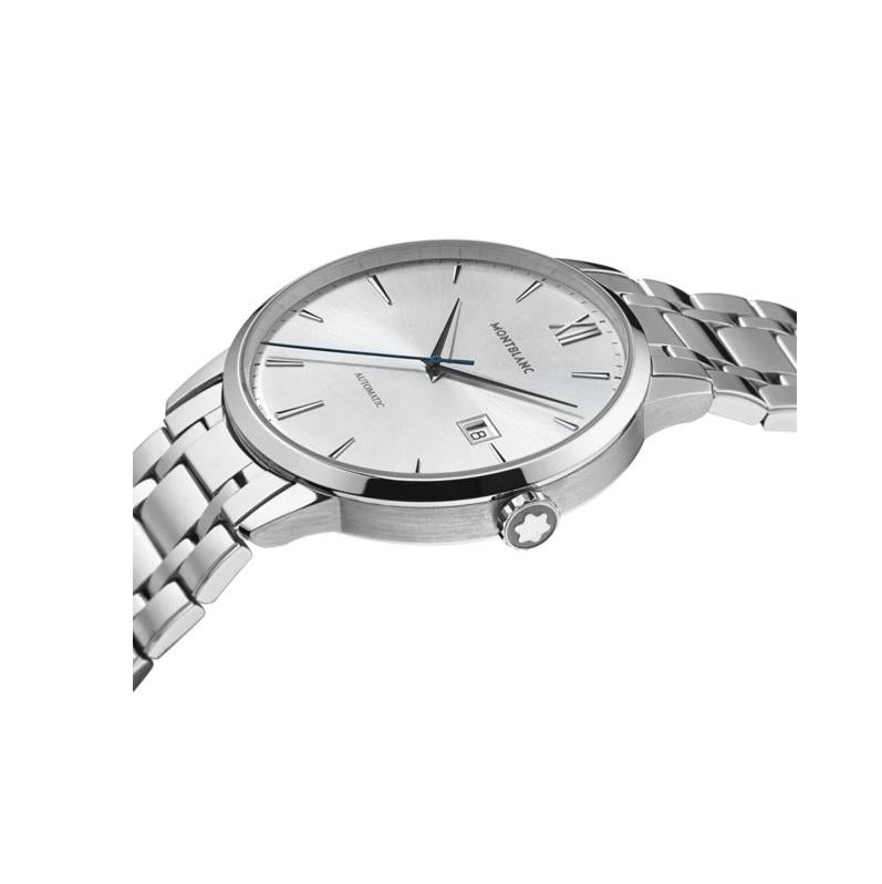 Stainless steel case with a stainless steel bracelet. Fixed stainless steel bezel. Silver dial with silver-tone hands and index hour markers. Roman numeral marks the 12 o'clock positions. minute markers around the outer rim. Dial Type: Analog. Date