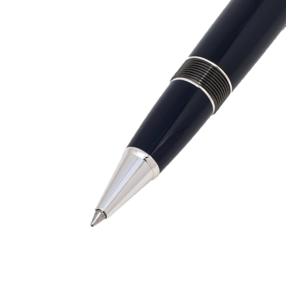 A refined appeal and meticulous design define this special edition rollerball pen from Montblanc. The pen is made from black resin and lacquer and has silver-tone metal accents. On it, there are engravings on the cap that also holds the signature