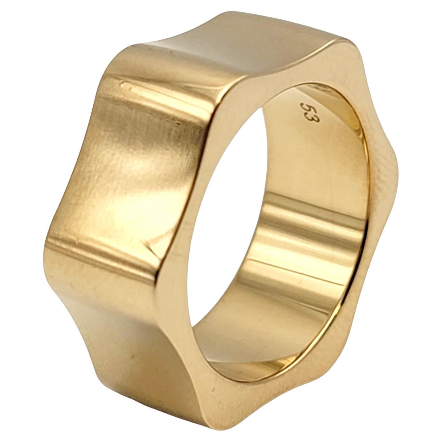 Ring size: 6.5

Stunningly simple yet elegant wide band ring by Montblanc. Made of sleek polished 18 karat gold, the subtle six sided 'star' ring makes a chic statement on the finger with its clean lines, perfect symmetry, and flawless elegance.
