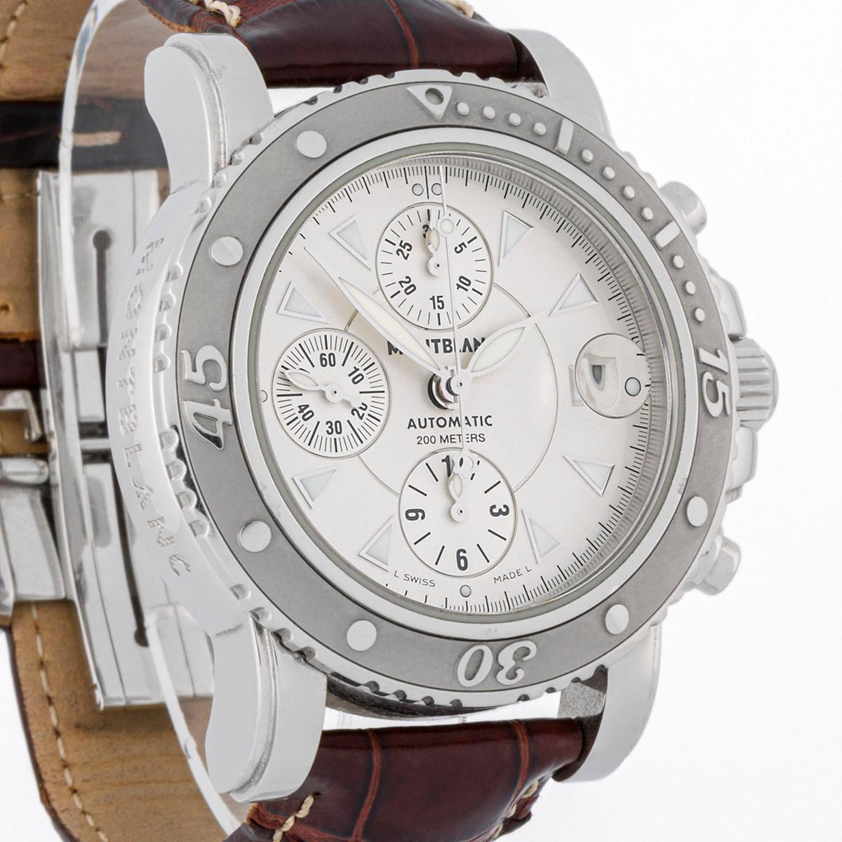 This timepiece, featuring a chronograph and calendar, features a silver-tone sunburst dial. The sunburst dial is a decorative finish applied to a watch face, giving the impression of sunbeams. It's a radial pattern that, when struck by light,