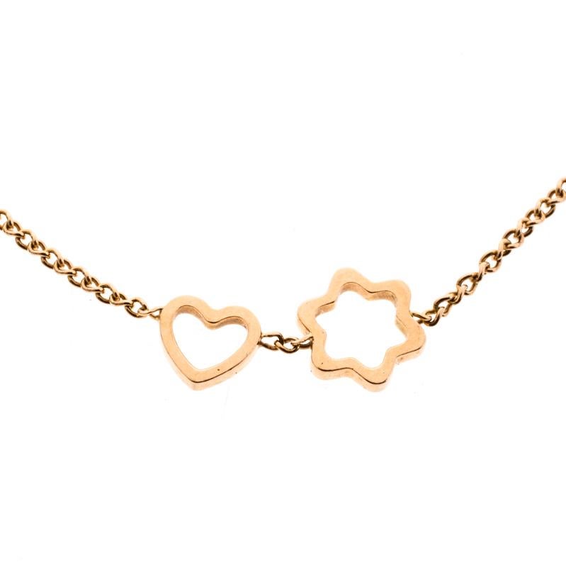 Montblanc brings you this lovely bracelet in 18k rose gold to adorn your wrist with beauty! The slender chain holds two charms, one in the shape of a heart and the other in the shape of the brand's star logo. The bracelet is complete with a lobster