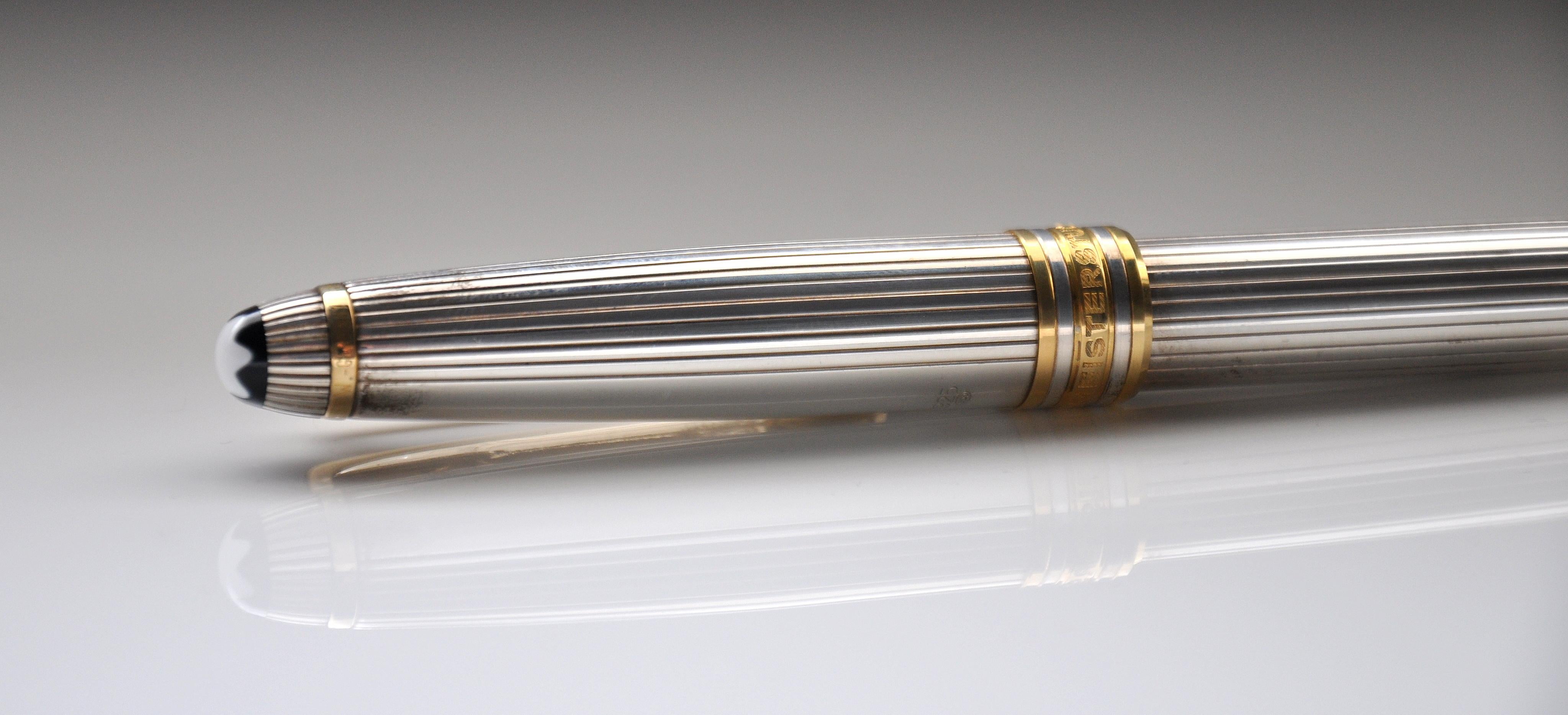 A vintage 925 silver Montblanc Meisterstück 165 mechanical pencil, in the Godron pattern. The pencil has a mechanical twist mechanism with 0.7 mm lead. The barrel and cap of this pencil are made of 925 sterling silver and feature a fluted or