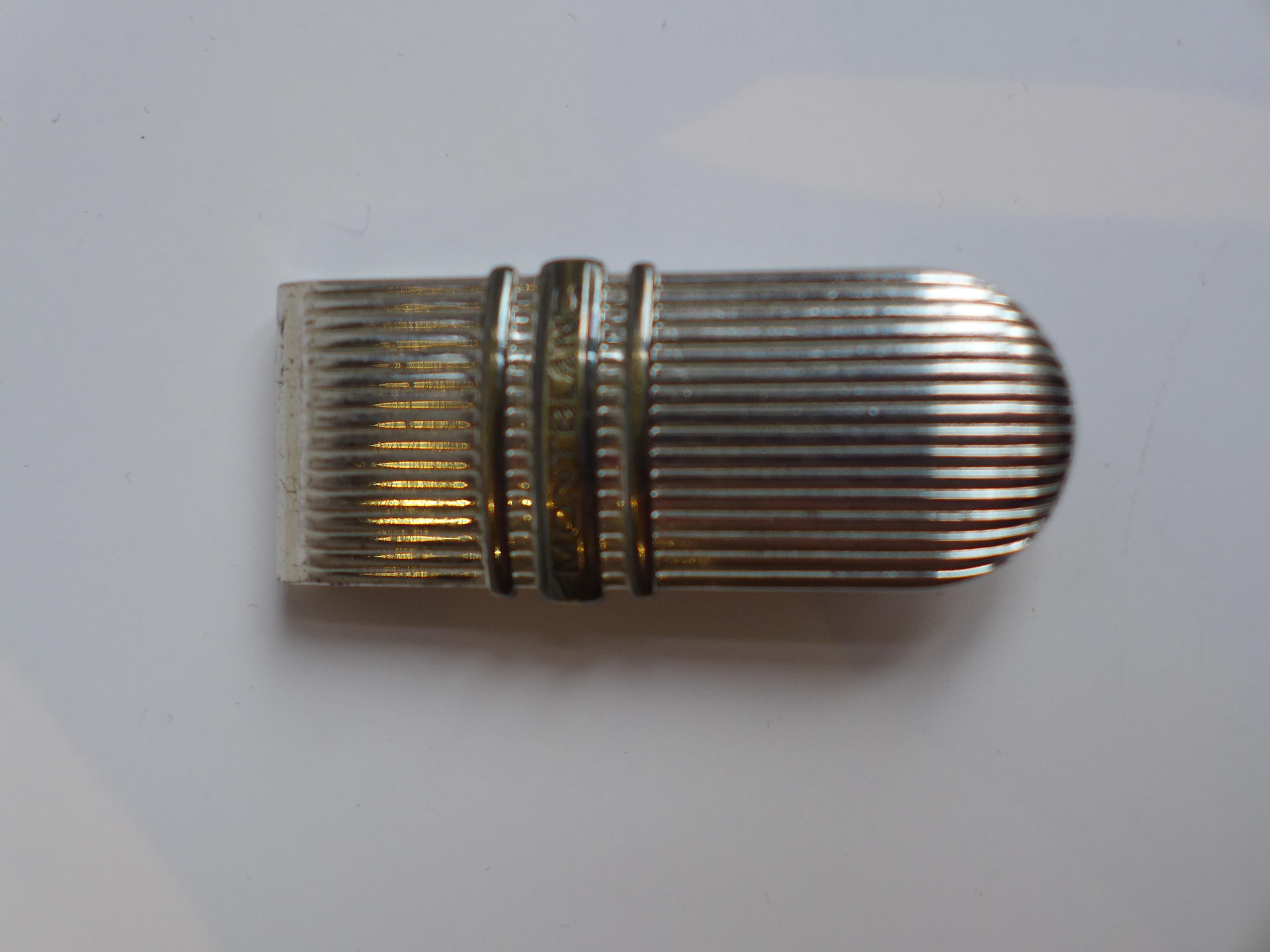 Montblanc money clip crafted from sterling silver, exemplifying the brand’s renowned precision and timeless elegance. This refined accessory combines practicality with luxury, making it a distinguished piece for collectors and connoisseurs of fine