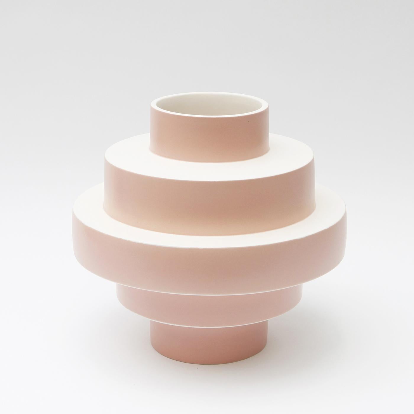 Show off your favorite flowers in style and enhance the look of your contemporary decor with the elegant and dynamic Monté vase in soft pink ceramic. Entirely hand crafted, this delightful accessory features a clever shape of layers of concentric