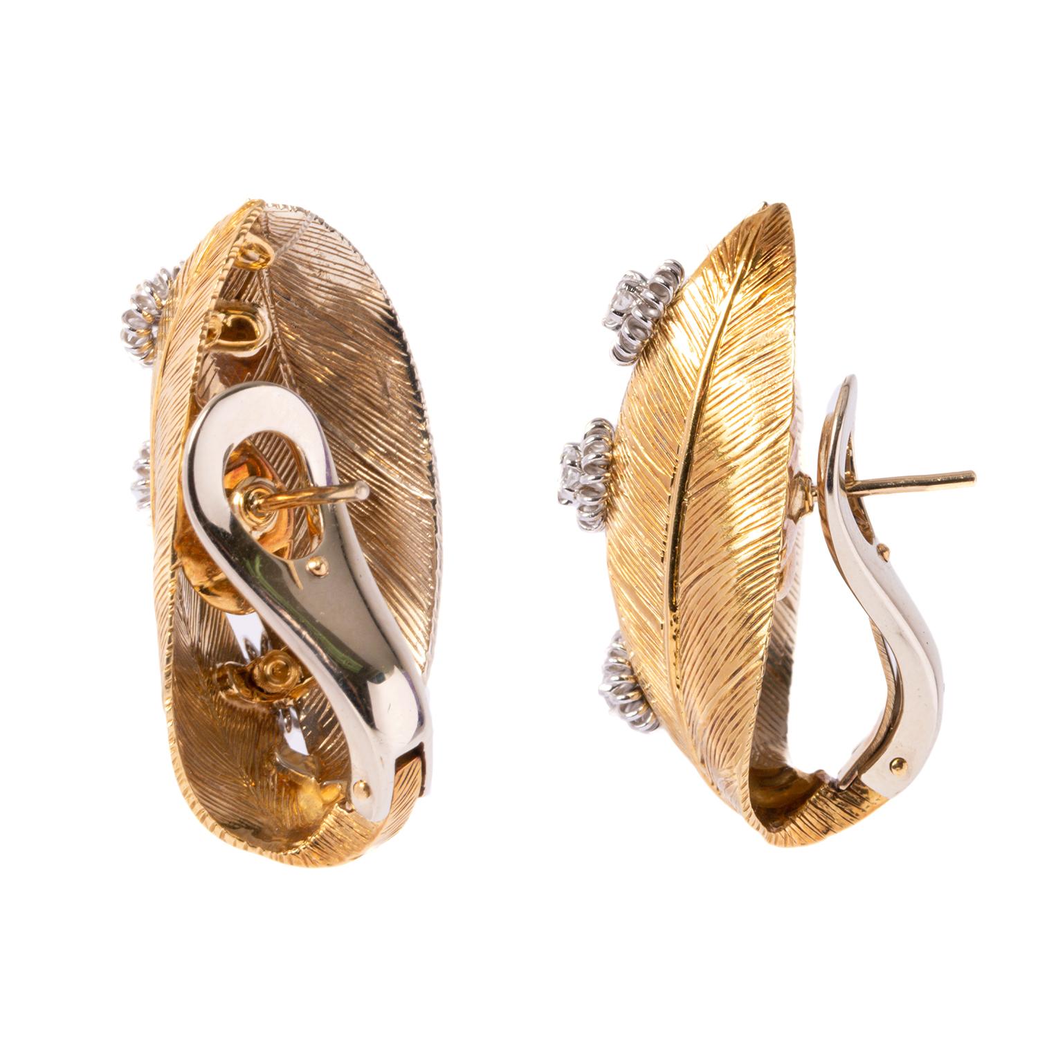 Beautiful earrings by the Italian designer Giancarlo Montebello. The earrings were designed directly for our Enrico Trizio 1868 jewelry. A very elegant pair of yellow gold earrings with leaf design and Diamond , 0.45 carats of White Diamonds.