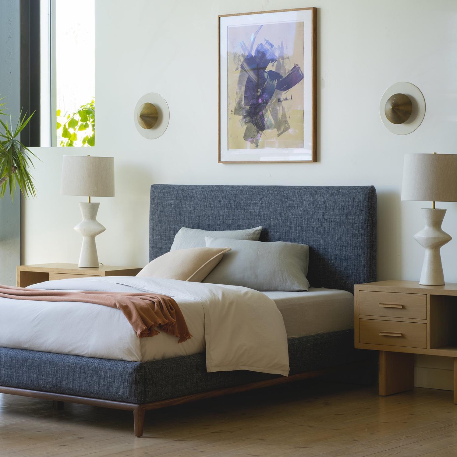 The Montebello bed is a clean and classic piece with an upholstered headboard and side rails. The base is made of turned solid American walnut or white oak. 

The Lawson-Fenning Collection is designed and handmade in Los Angeles, California. Reach