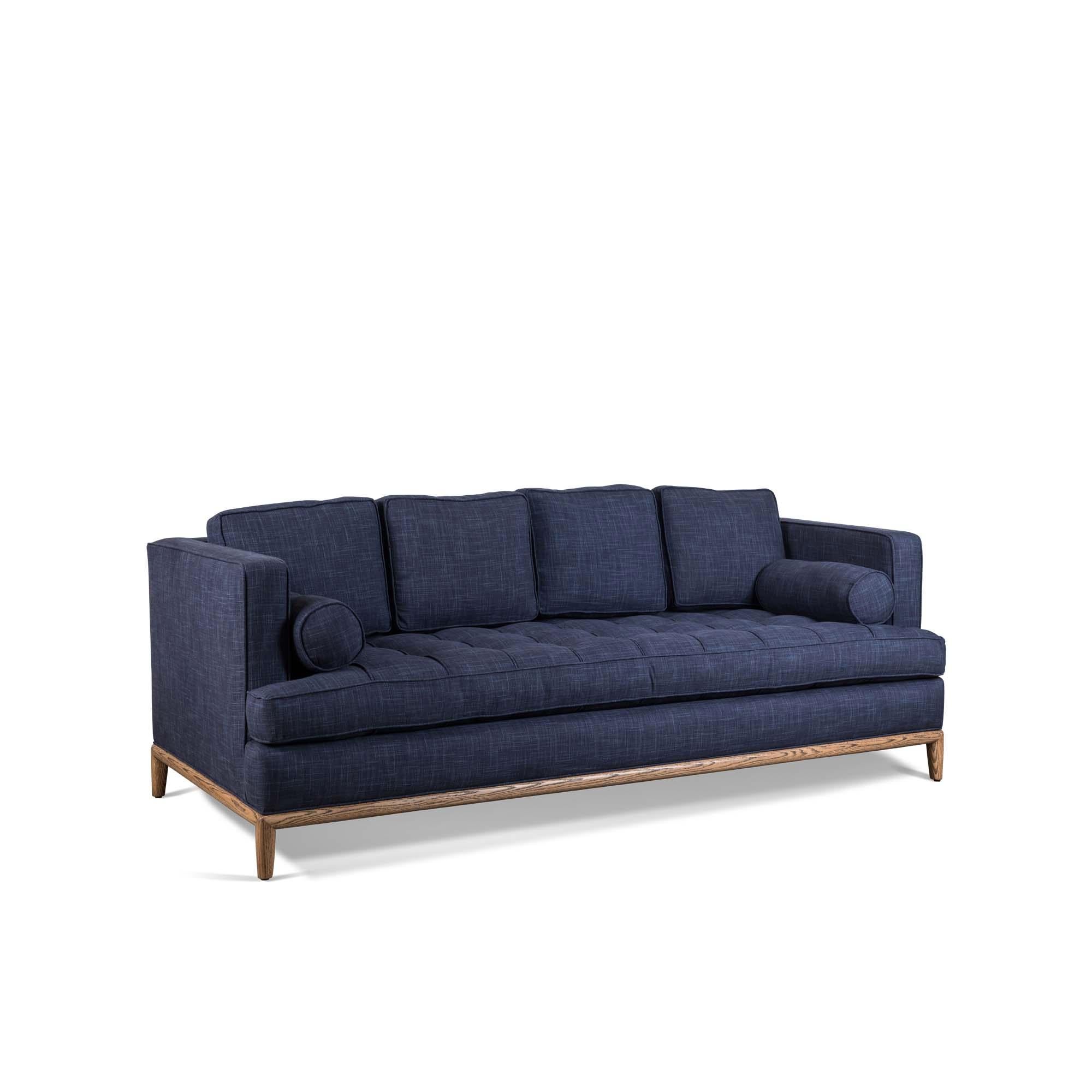 The Montebello Sofa is a tuxedo-style sofa with a button-tufted seat and wooden base. Comes with either 3 or 4 down-wrapped cushions and 2 bolster pillows.

The Lawson-Fenning Collection is designed and handmade in Los Angeles, California.
Reach