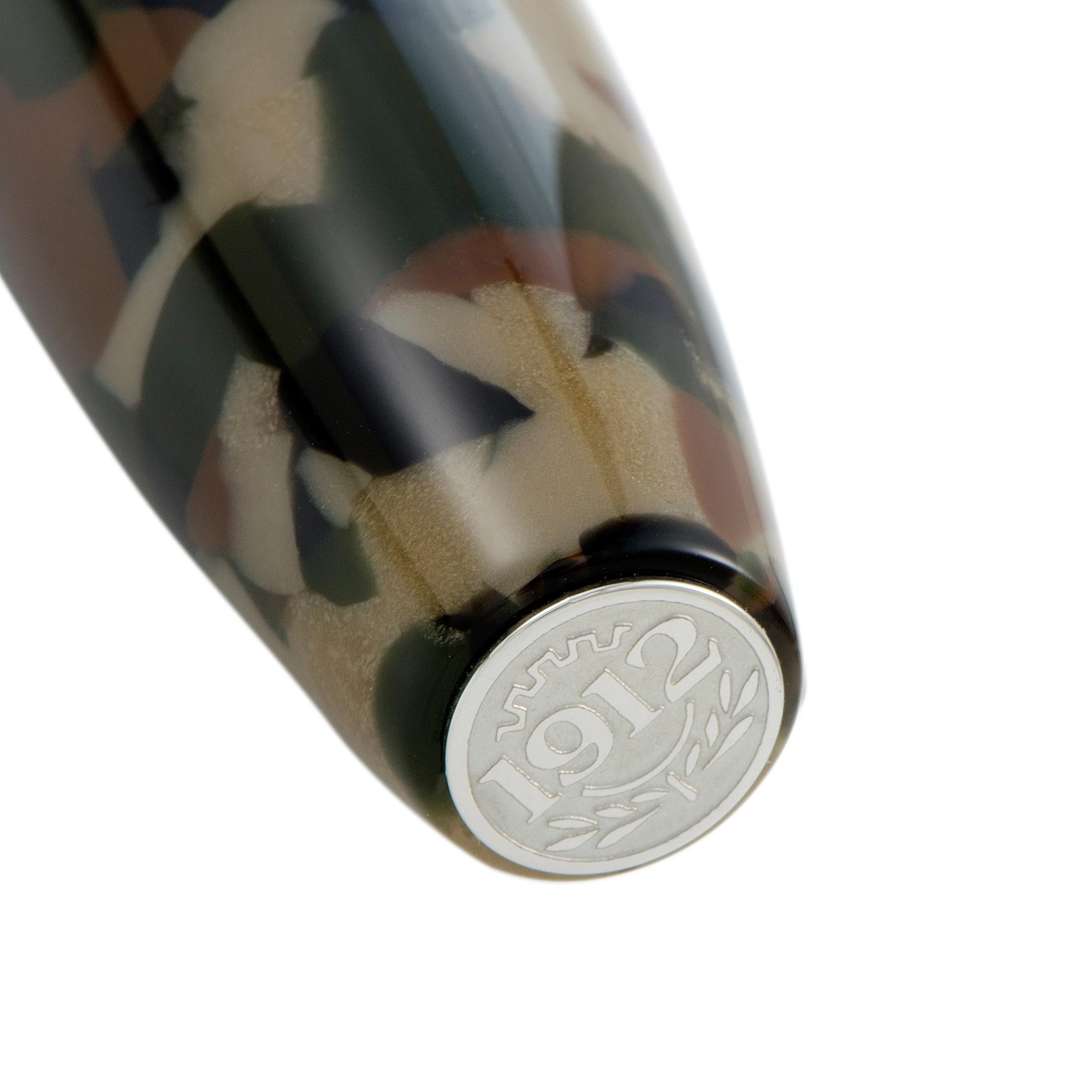 This exceptional ballpoint pen is created by Montegrappa for the exquisite “Fortuna” series and it boasts the compelling camouflage pattern that gives an incredibly masculine appeal to the pen. The cap top has the number “1912” engraved, the year