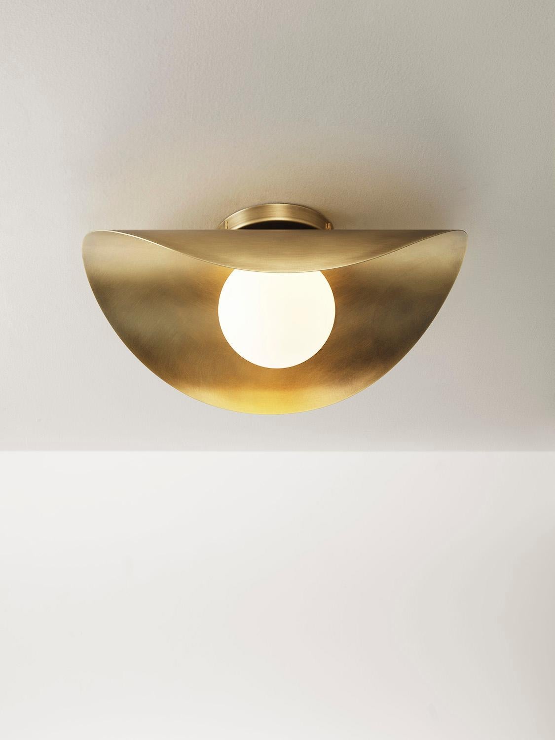 Introducing the Montera Flushmount, a sleek and versatile addition to our collection. Unlike its pendant counterpart, this fixture foregoes the drop rod for a seamless integration into ceilings or walls. Its undulating, biomorphic form casts a soft,