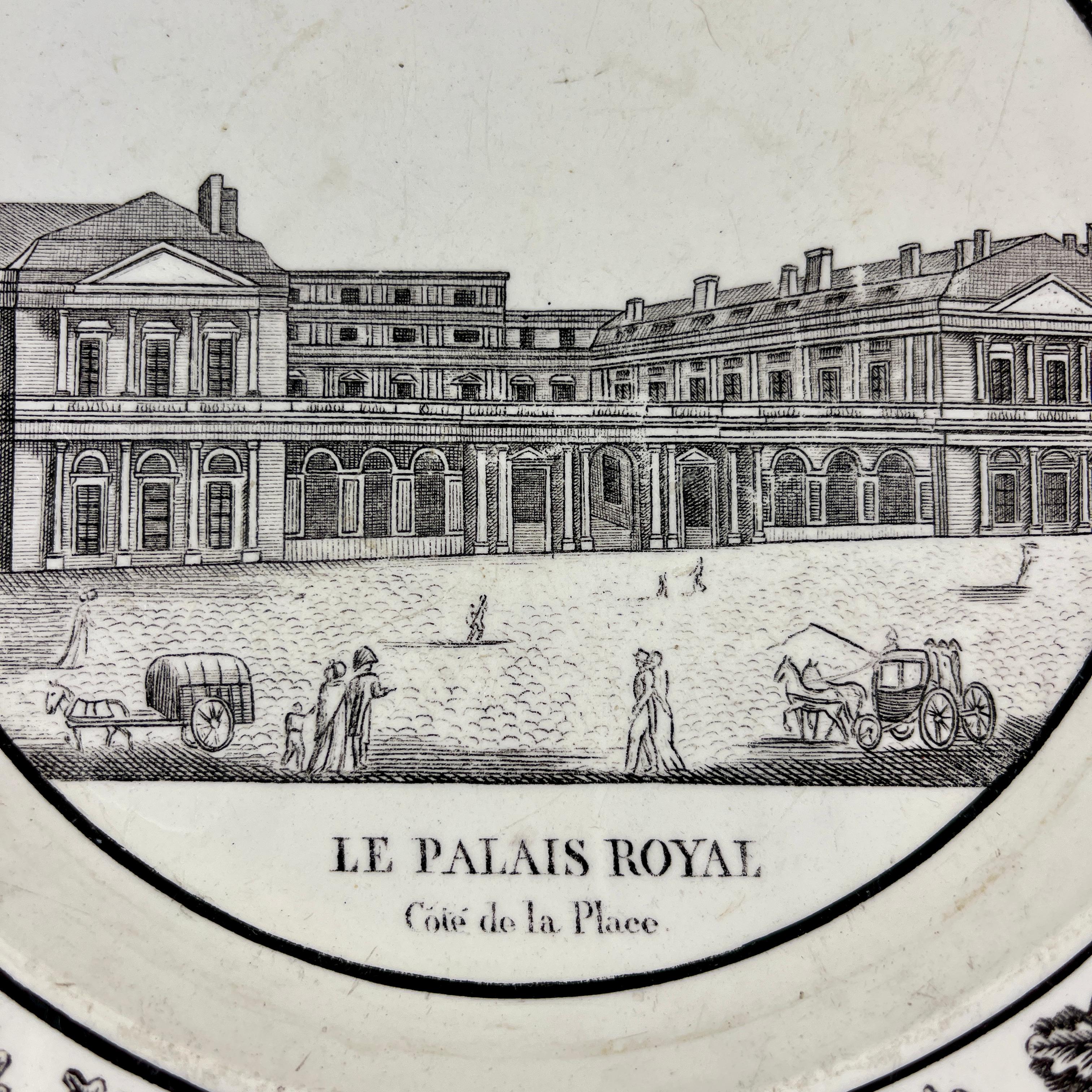A French Neoclassical faïence transfer printed creamware plate produced by Montereau, Creil, circa 1824-1836.

A black transfer of an architectural image on a creamware body, depicting Le Palais Royal à Paris. The building is prominent, with the