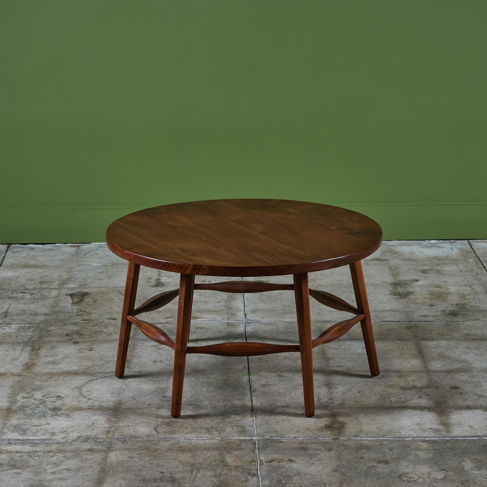 Monterey round coffee table c.1930s, USA. This example, produced during the Monterey period in California is finished in a dark walnut stain and features six splayed legs all connected by stretchers.

Dimensions
31.5