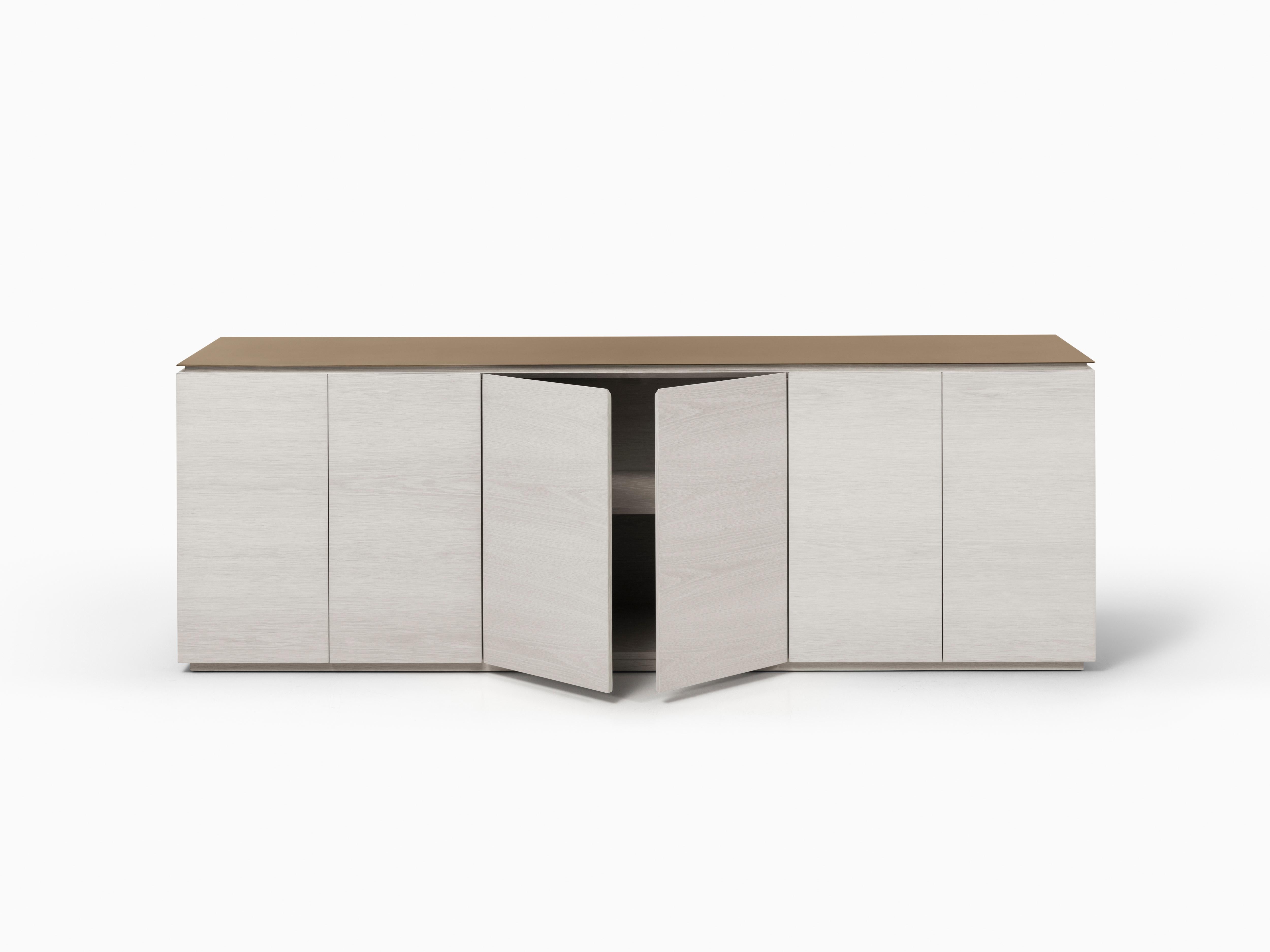With a minimal design that showcases expertly crafted materials, the Monterrey Credenza by Chai Ming Studios combines storage with style for any space. Six touch-latch doors reveal a bevel edge detail and three adjustable shelves that provide