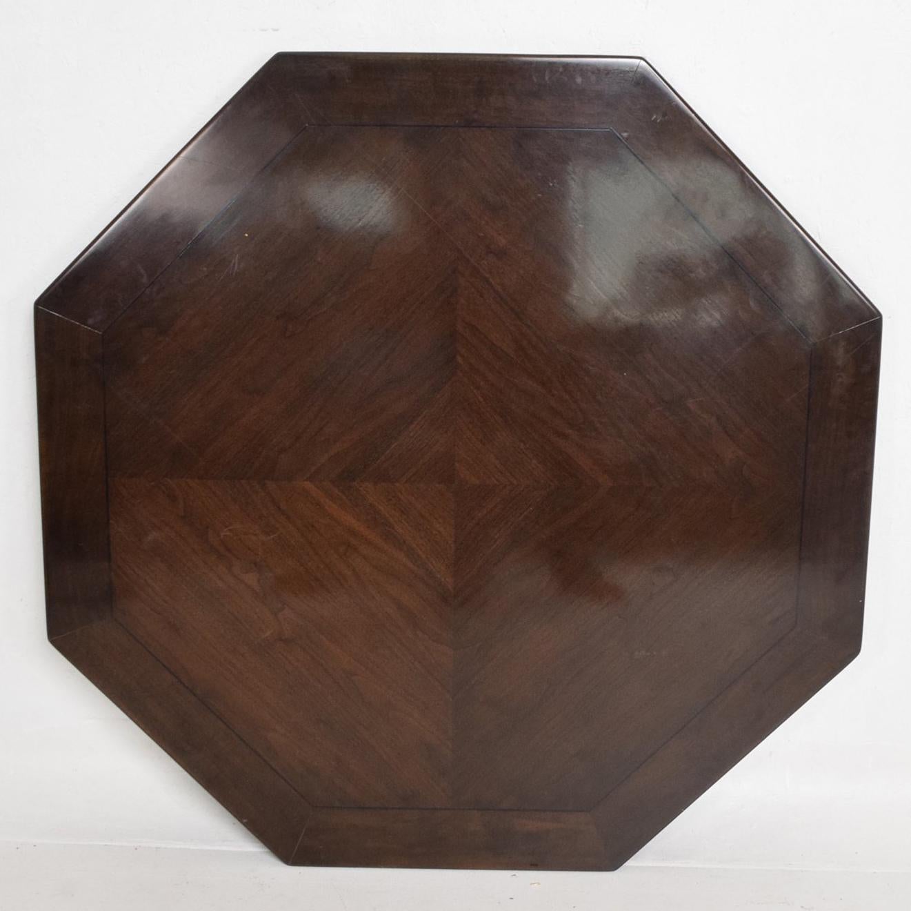 For your consideration a beautiful walnut dining table attributed to Monteverdi & Young. No label present. Great quality. Legs and edges are solid wood. Center top appears to be walnut veneer in plywood. 

Sculptural shape with great unique