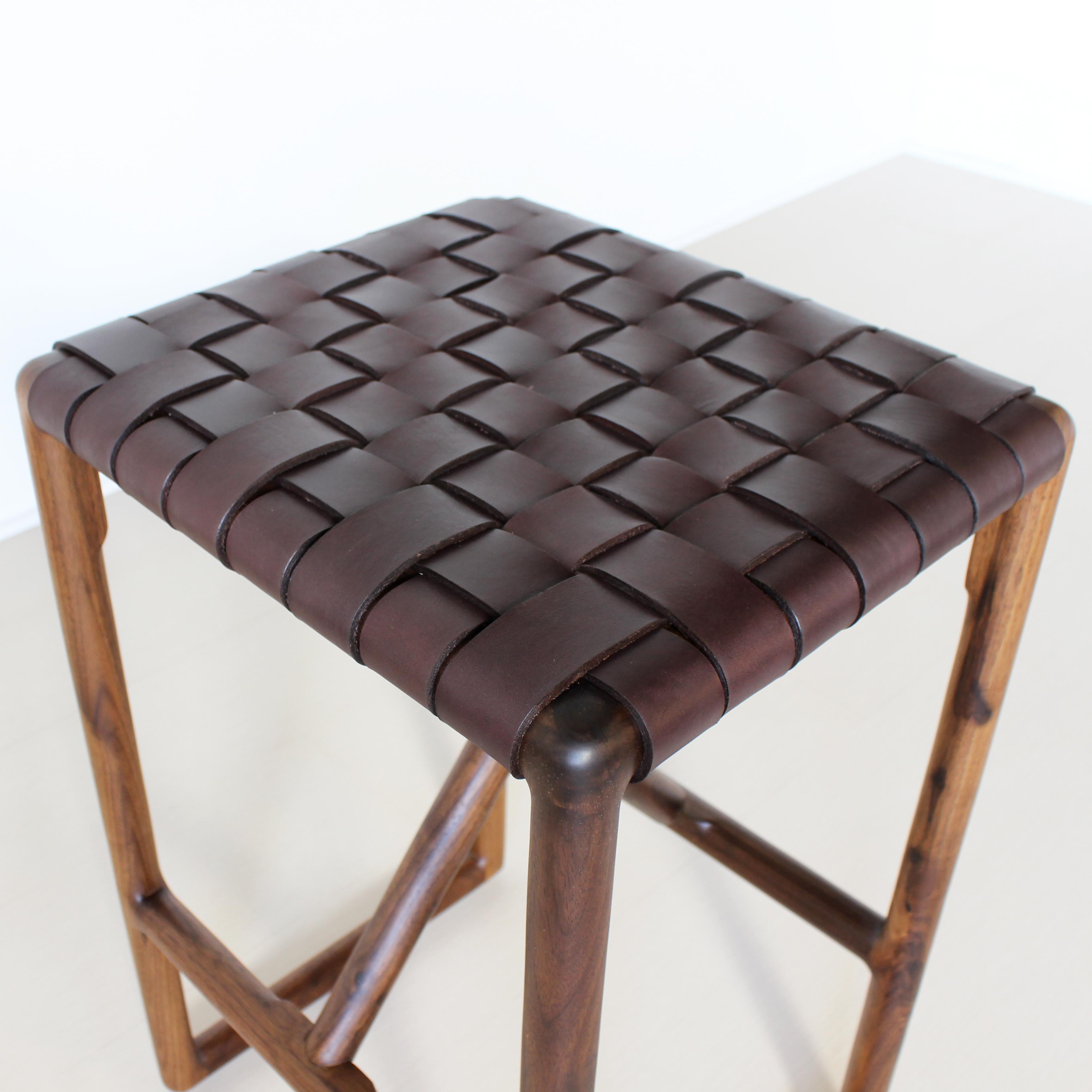 Montgomery Stool
by Crump and Kwash

Solid wood frame / handwoven vegetable tanned leather seat / no VOC oil finish

Dimensions: 
16 W X 14 D X 24 H
16 W X 14 D X 30 H

Wood: Walnut, Maple, Blackened Oak, White Oak

Leather: Natural, Black, Brown,