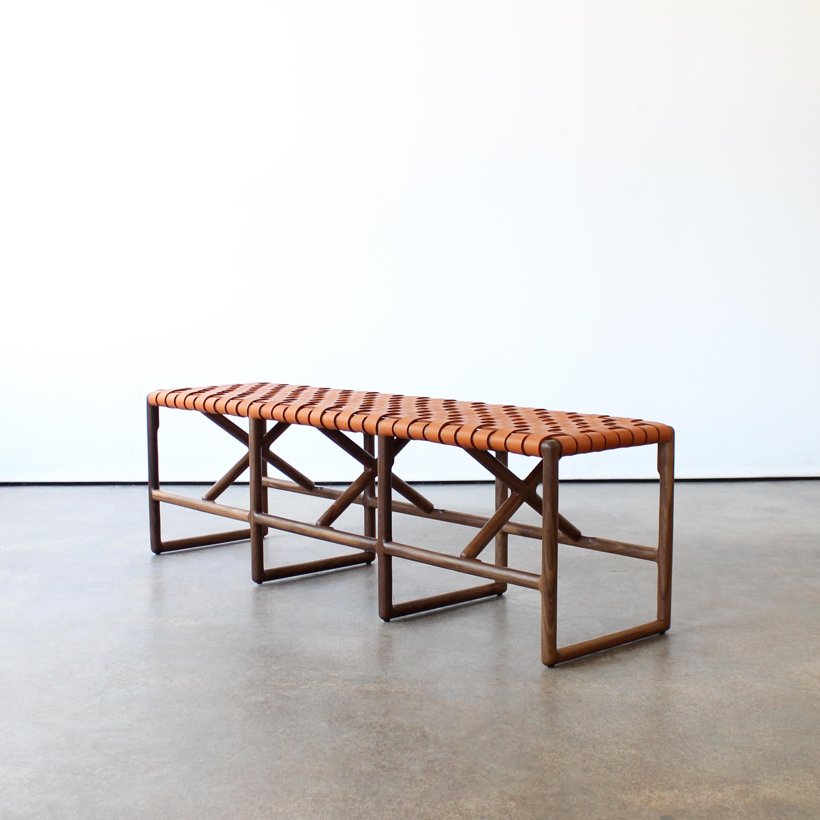 Montgomery bench by Crump and Kwash 

Hand shaped solid wood frame / hand woven vegetable tanned leather seat / hand rubbed oil finish

72” w x 16”d x 18”h

Customizations available.