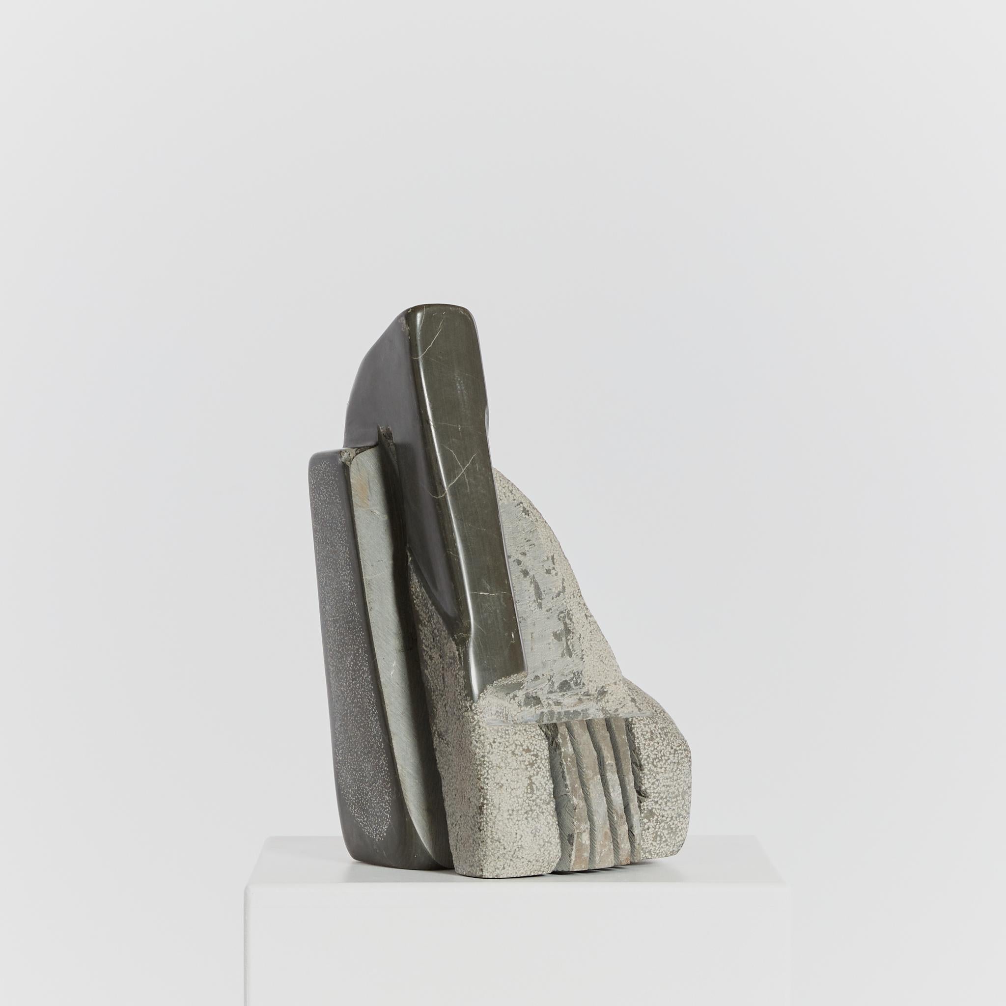 A multi-faceted abstract sculpture carved from Czechian mokra limestone. This piece features stippled, raw and polished angles alongside deep repeated grooves. Signed by the late renowned sculptor Michel Hoppe (1939-2022). 

Artist: Michel