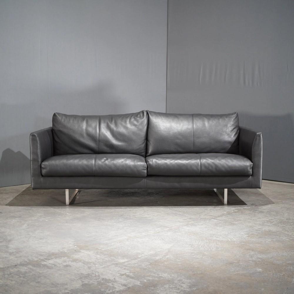 The Montis Axel 2-Seater Black Leather Sofa is a sleek and stylish addition to any home. Montis is known for its contemporary and high-quality furniture, and this sofa offers both comfort and elegance with its premium leather and modern design.