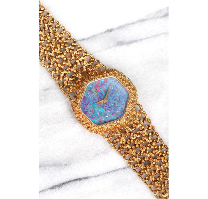 Here's a vintage Roy King Montre Royale in 18K Yellow Gold Manual Wind with a factory black opal stone dial from the 1970s. Keeps great time and is fully functional. Measurements include a 36mm case and an integrated gold bracelet that fits up to a