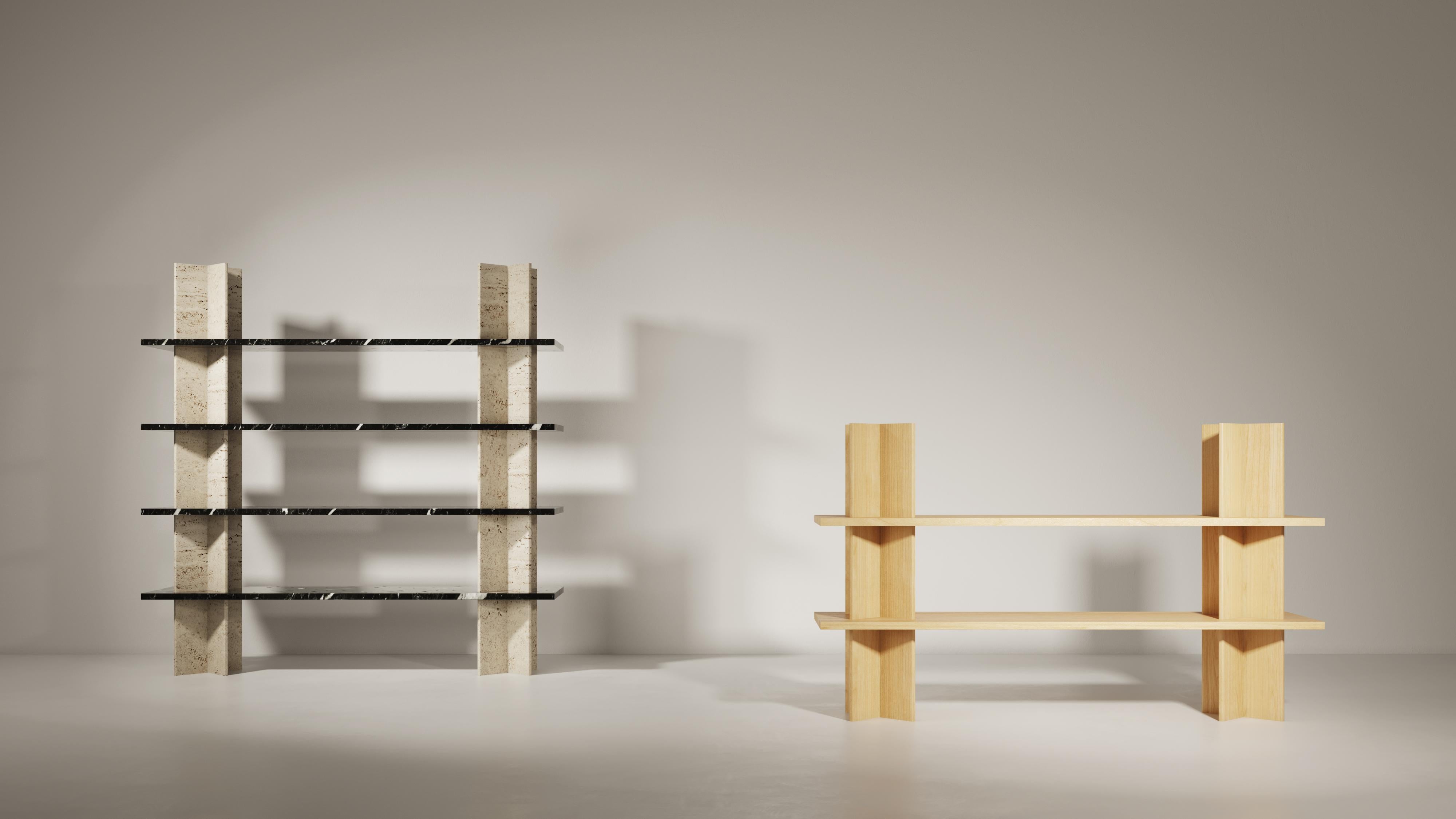 Monument is a collection of shelving units that combines wood and marble. This piece was imagined by Mathieu Girard and Gauthier Pouillart of Atelier Cocorico.
The visual strength and stability of Monument relies on an ingenious construction system