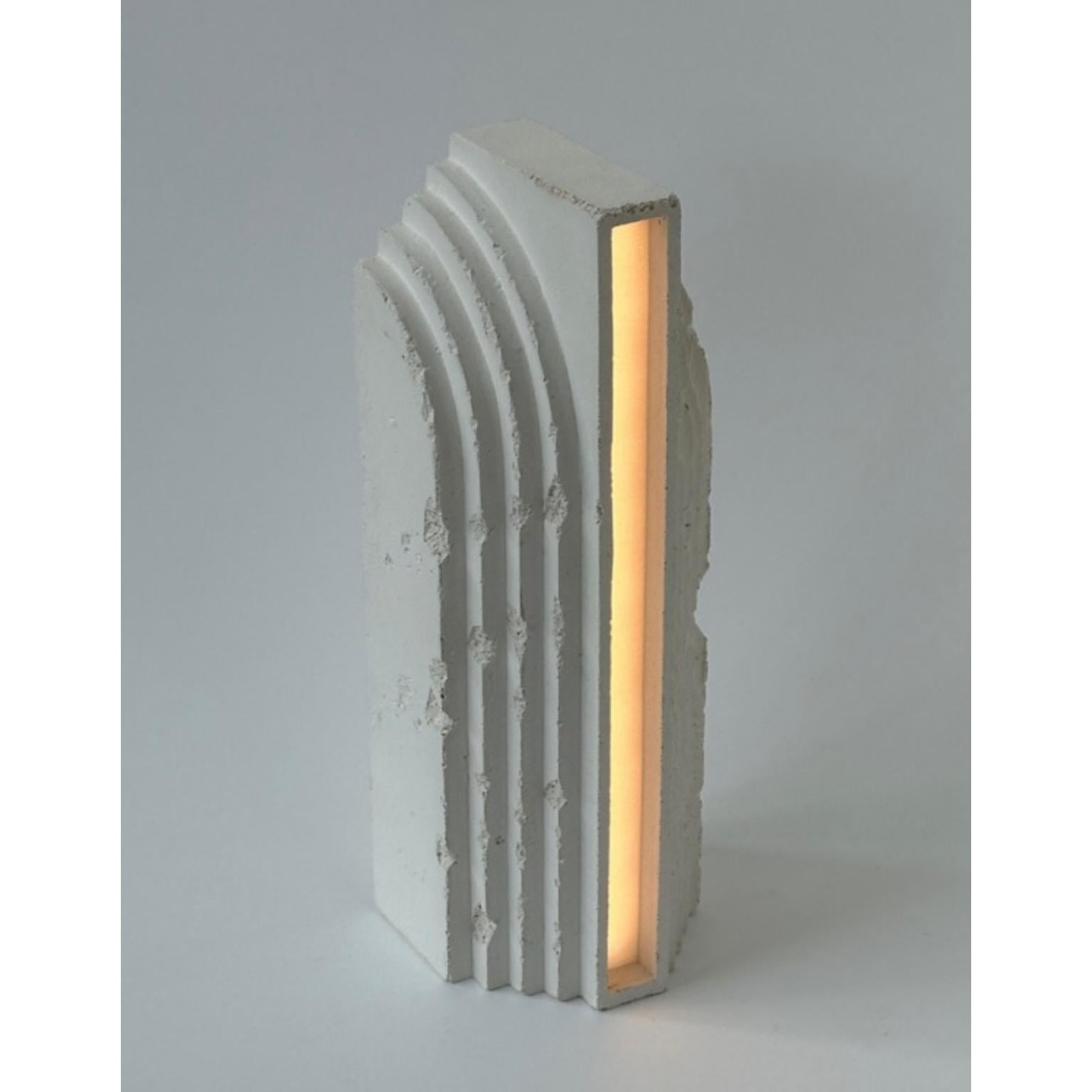 Monument Recto Aged Table Lamp by Eingang Studio
Limited Edition.
Dimensions: D 10 x W 11 x H 30 cm.
Materials: Concrete.
Weight: 2 kg.

LED 110-220V, variable light, EU or US plug. Possibility of aged finish. Please contact us.

All our lamps can
