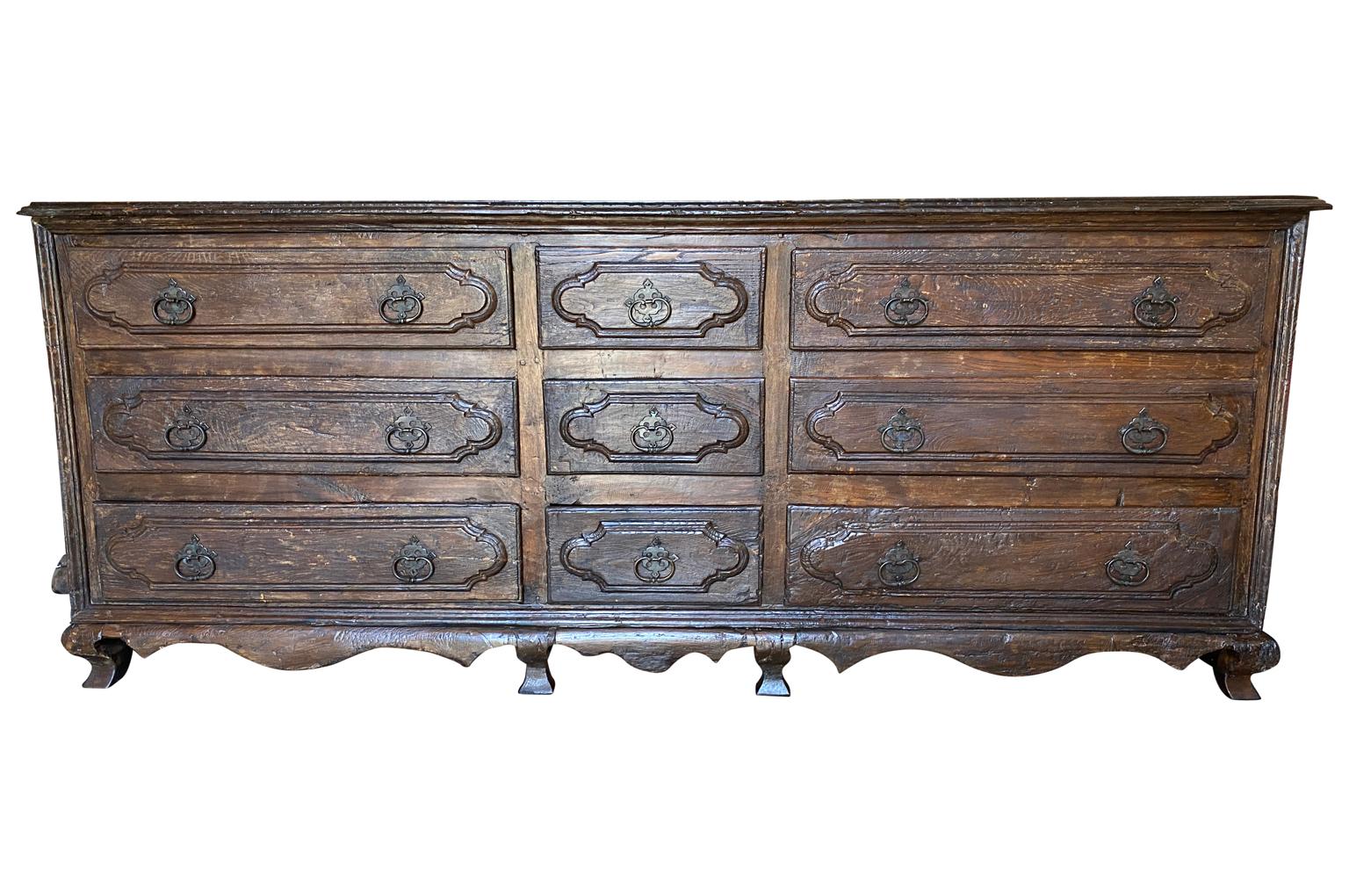A monumental and very rare 17th century Sacristy Commode from Venice, Italy. Wonderfully constructed from chestnut with nine drawers and a sculpted apron. A truly impressive piece that will be the star of its surrounding.