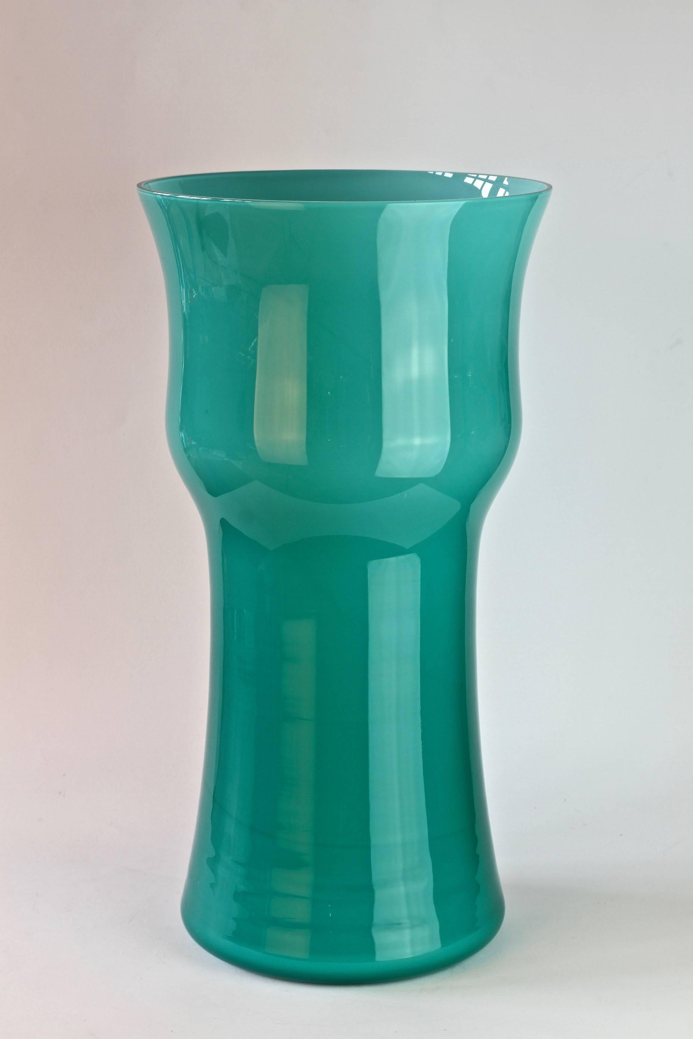 Monumental 18 inch tall centre vase by Cenedese Vetri of Murano, Italy. Particularly striking is it's elegant form and bold, petrol blue/turquoise color.

This is one vessel from a huge collection - available in our 1stdibs store - of Murano glass