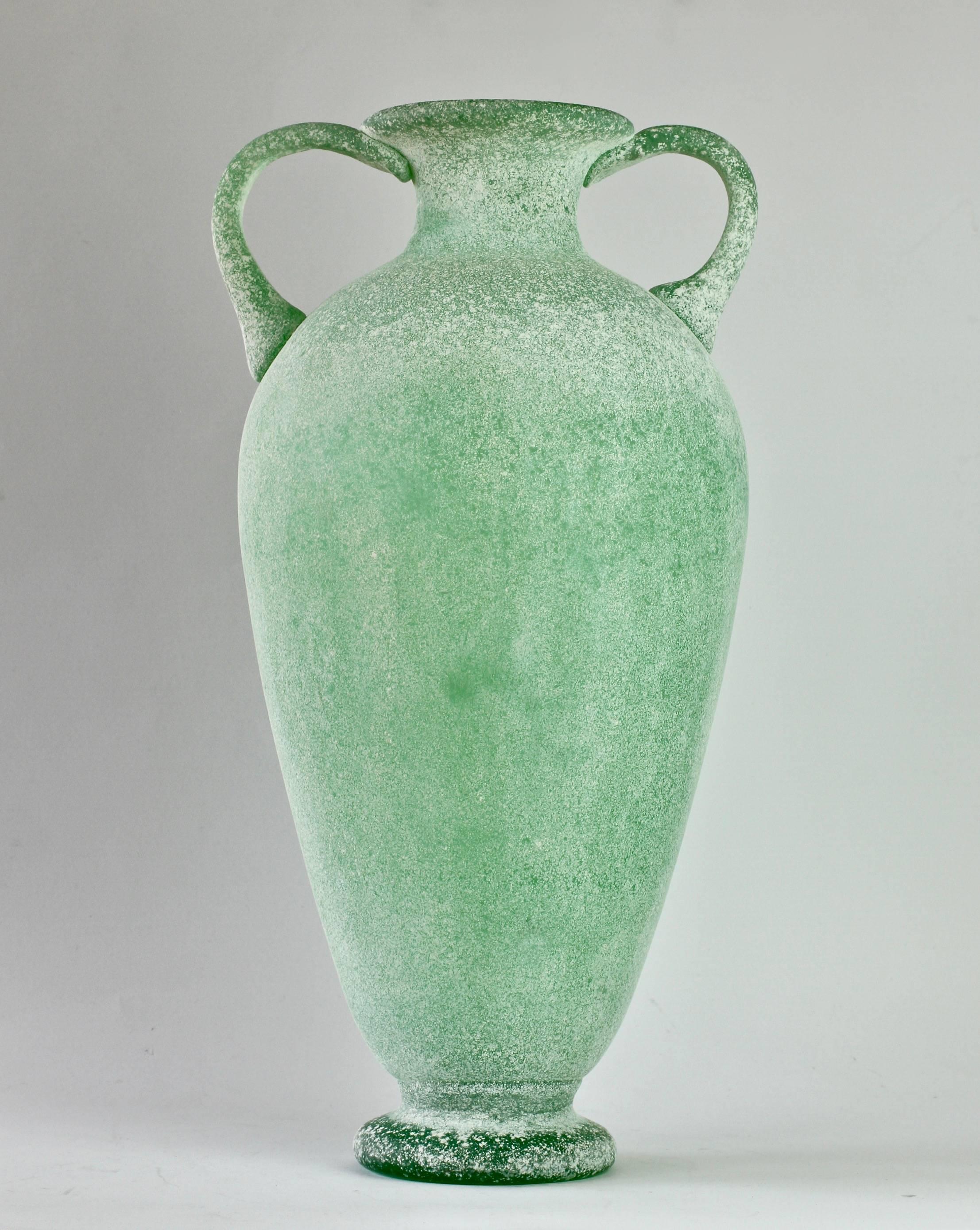 Monumental 18 inch tall 'a Scavo' green colored / coloured glass amphora or vase attributed to Seguso Vetri d'Arte Murano, Italy. Elegant in form and showing extraordinary craftmanship with the use of the 'Scavo' technique to replicate to look and
