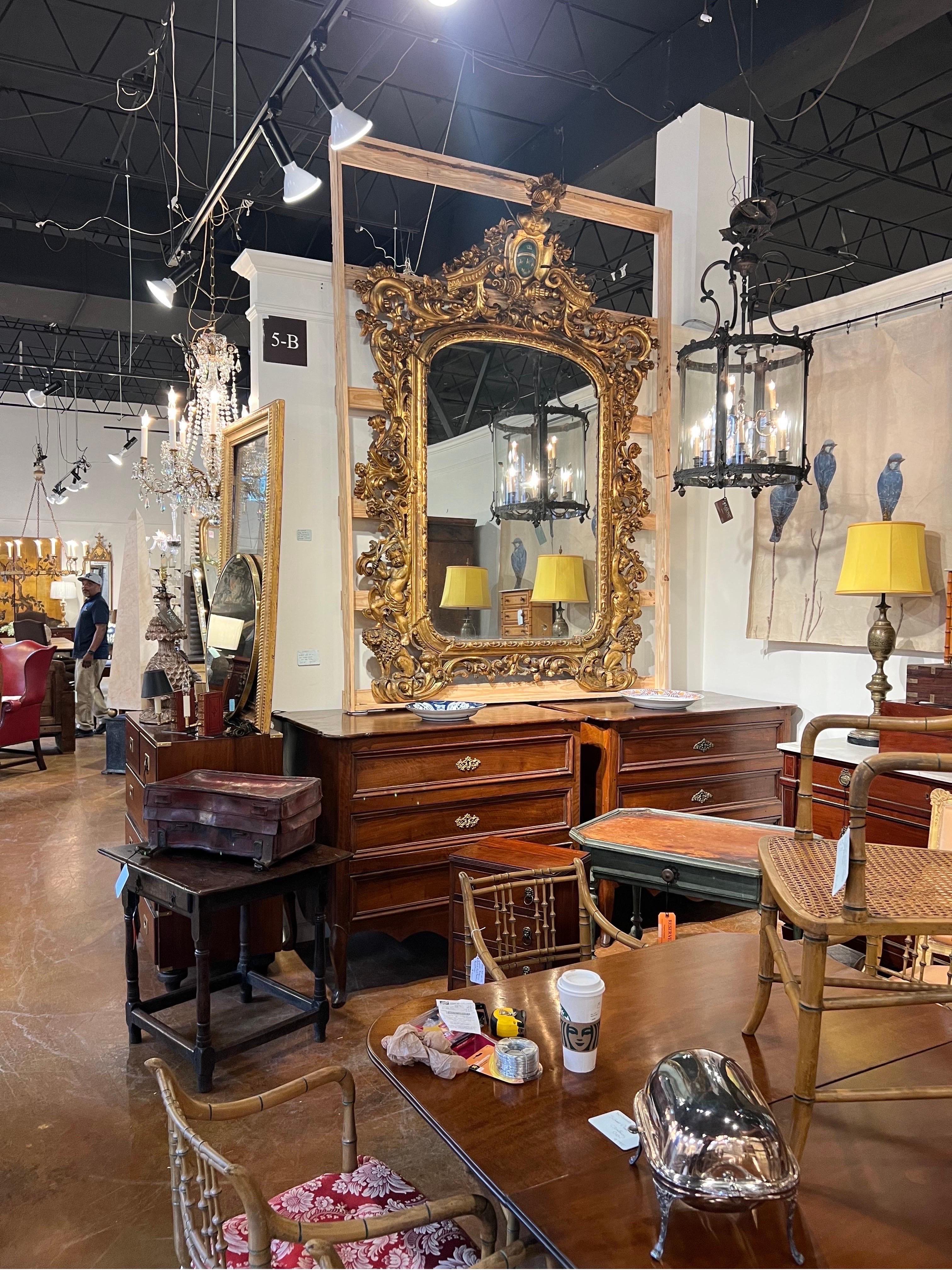 Mirror Monumental 18th-19th century Giltwood mirror with coat of arms  For Sale